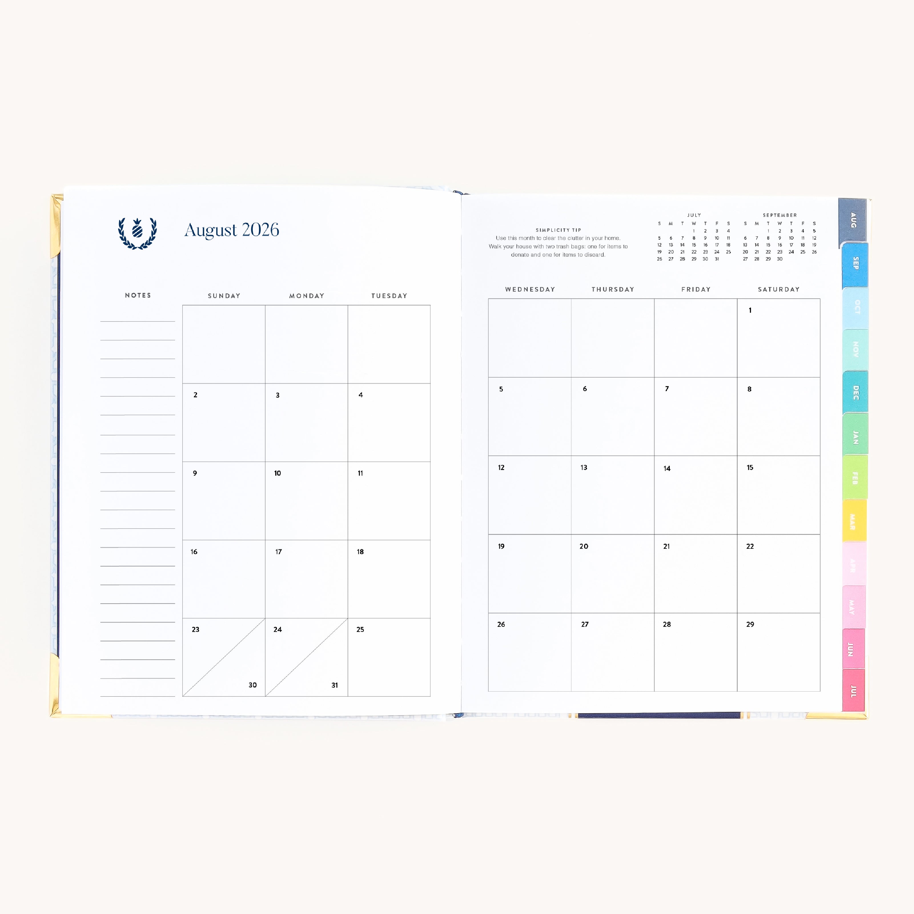 August monthly spread in bookbound weekly planner with calendar grid for planning goals, events, and routines