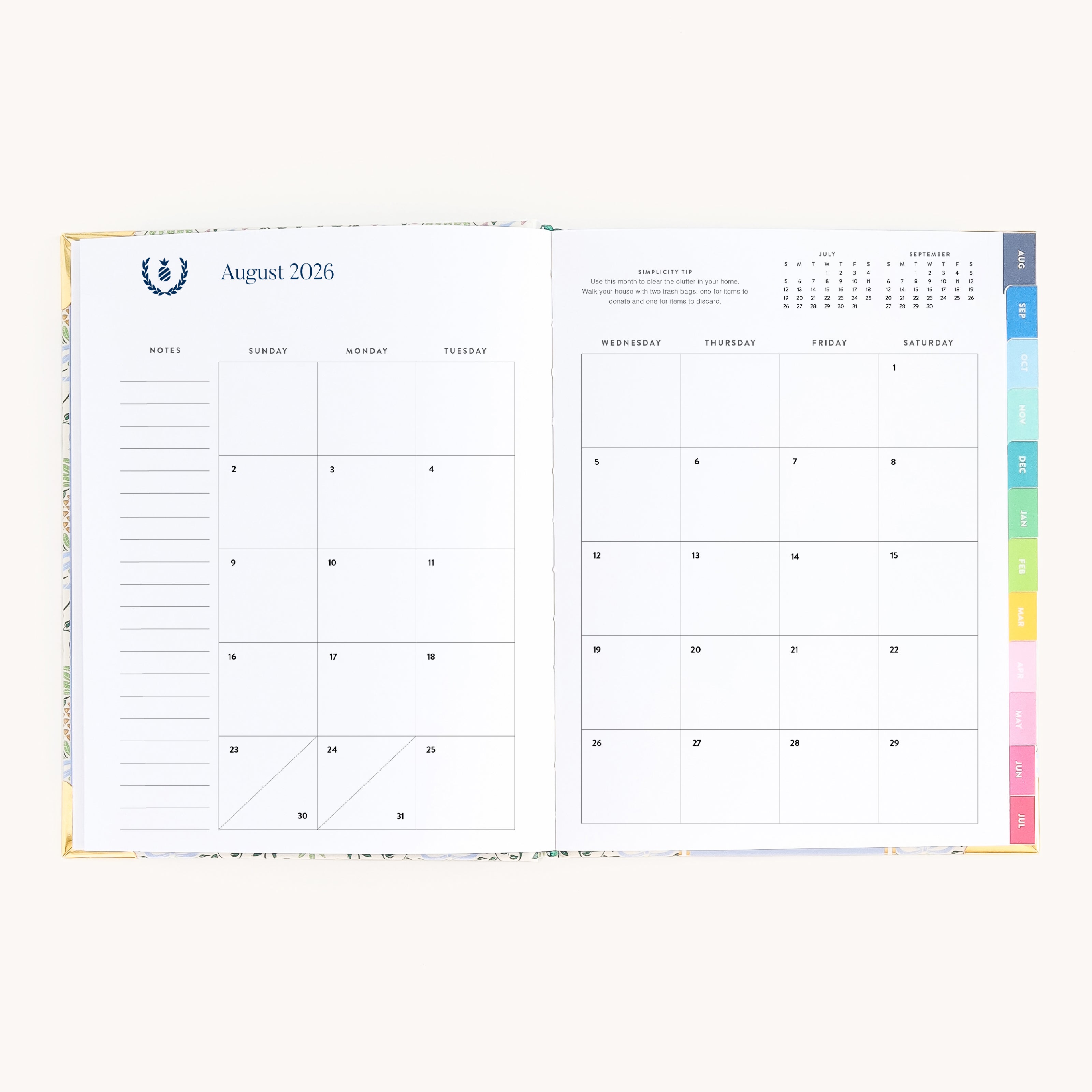 August monthly spread in bookbound weekly planner with calendar grid for planning goals, events, and routines