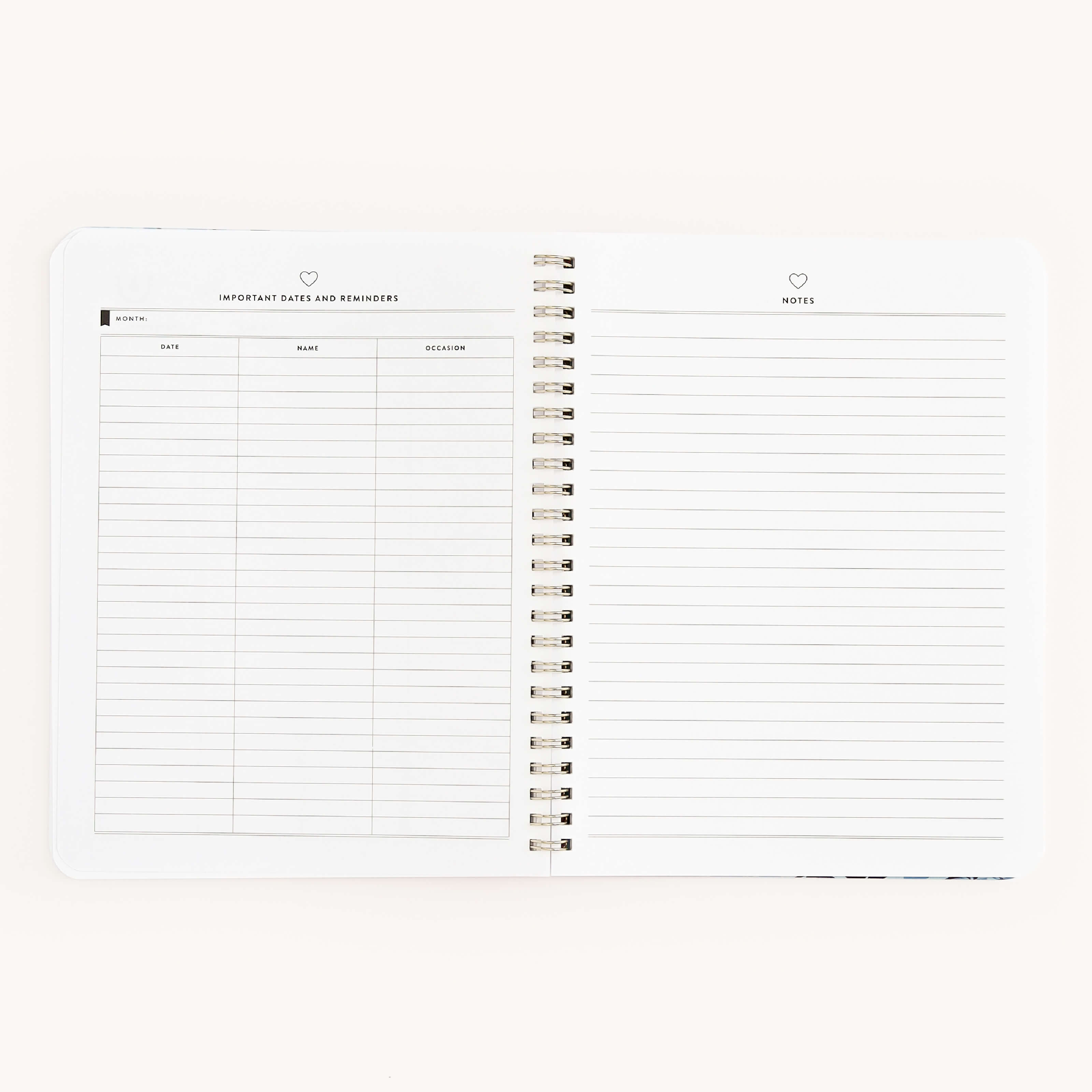 The Workbook - Friendship by Simplified is open on a white surface. The left page: Important Dates and Reminders, ideal for planning, with date, name, and occasion columns. The right page: Notes, lined for ideas promoting growth and change. Features a simple, minimalistic design.