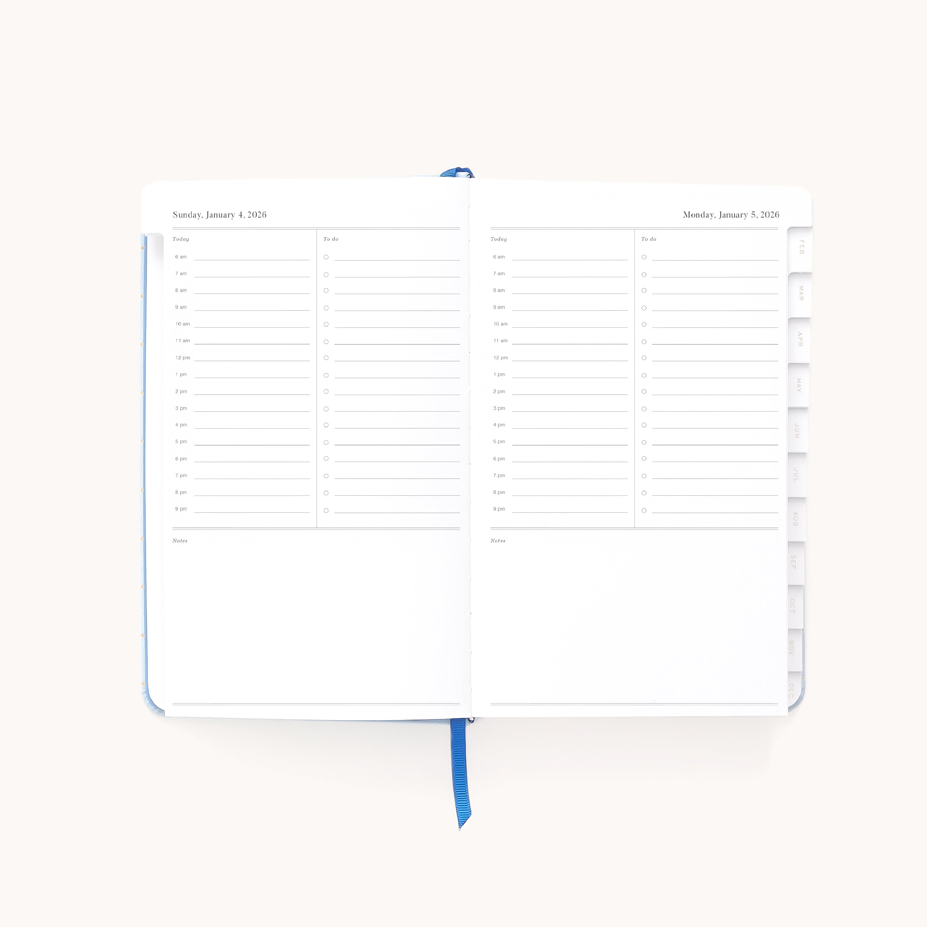 The Simplified 2026 Bookbound Daily Dapperdesk Planner - Carolina Dot is shown open to January 4–5, displaying hourly slots, checkboxes, a notes section, a blue ribbon bookmark, and right-side tabs.