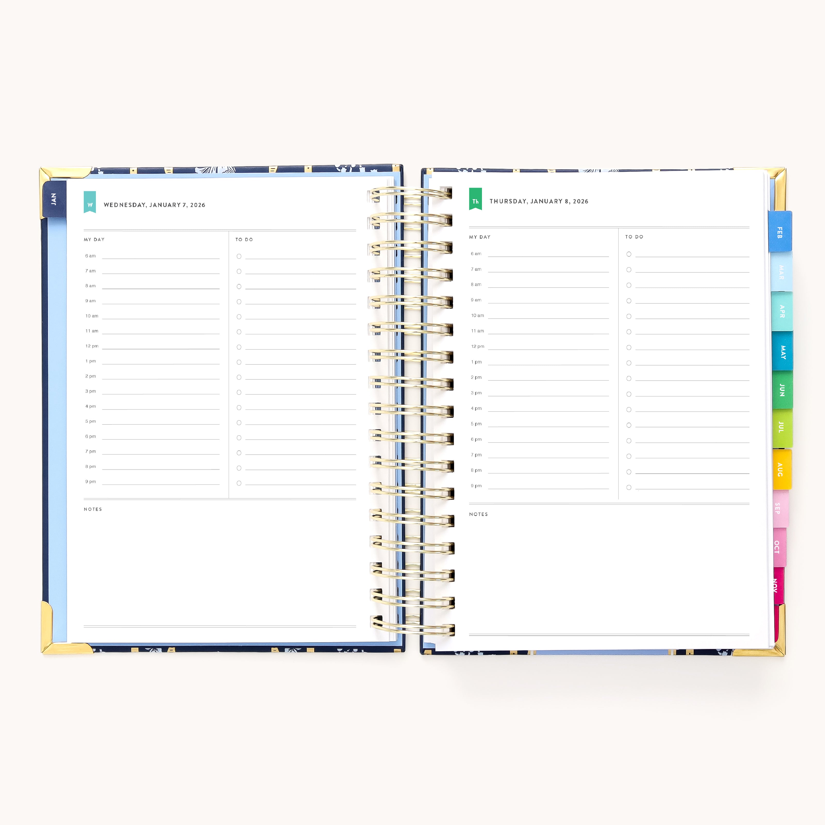 An open 2026 Spiral Daily Simplified Planner - Poppy Posies by Simplified displays hourly slots, blank notes, and colorful dividers—showing Wednesday, January 1, and Thursday, January 2. Ideal for daily planner enthusiasts.