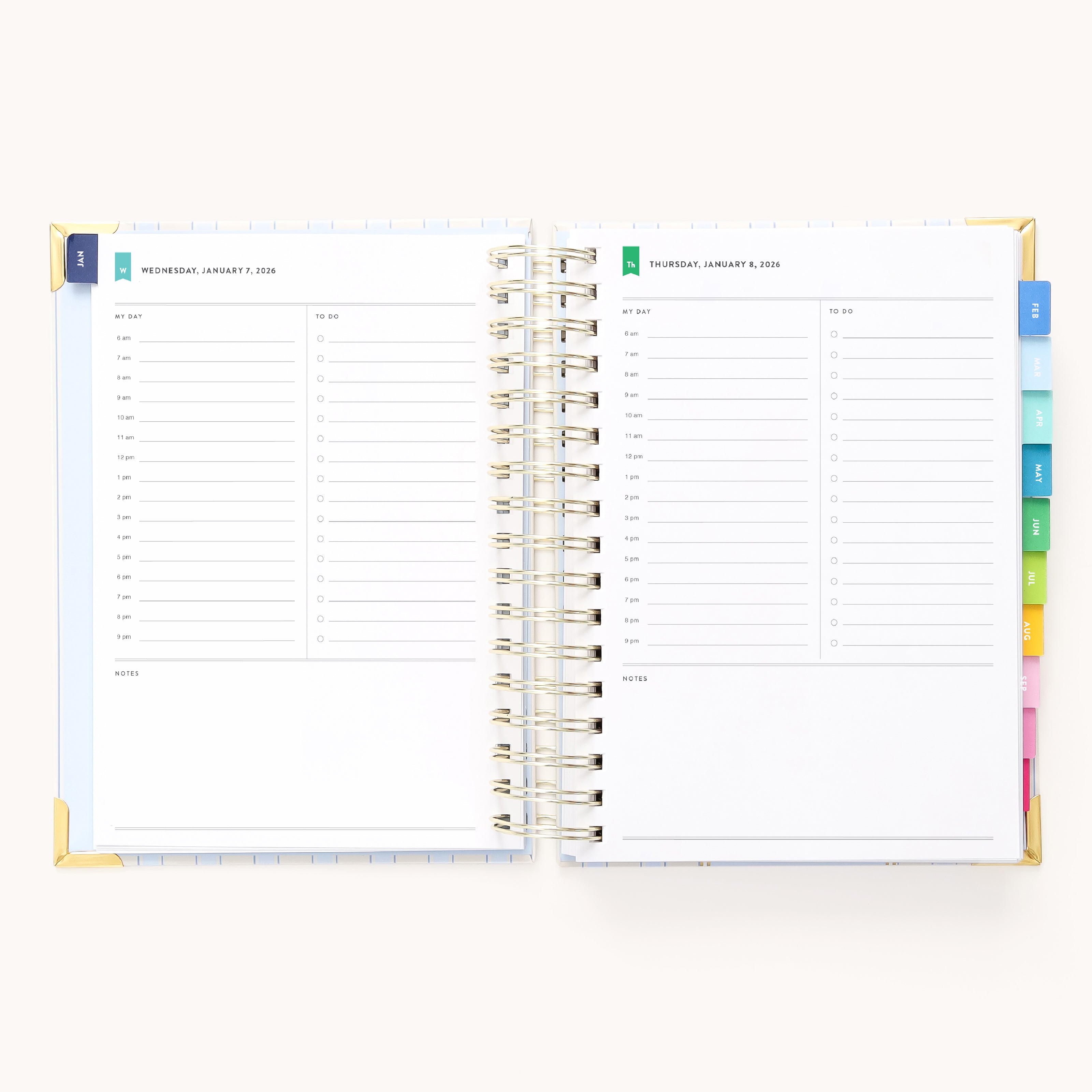 An open 2026 Spiral Daily Simplified Planner - Serene Stripe by Simplified displays two blank daily pages with time slots, notes sections, and colorful tab dividers, shown for Wednesday and Thursday.