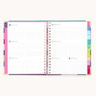 The 2026 Spiral Weekly Simplified Planner - Rainbow Row by Simplified features colorful tabbed dividers, dated lined sections with daily icons, and vibrant multicolored edges—perfect for keeping your weeks organized all year.