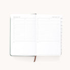 The Simplified 2025-2026 Bookbound Daily Dapperdesk Planner - Evergreen features a layout for August 6th and 7th, perfect for detailed planning with hourly slots from 7 AM to 9 PM, a notes section, white pages, and a ribbon bookmark.
