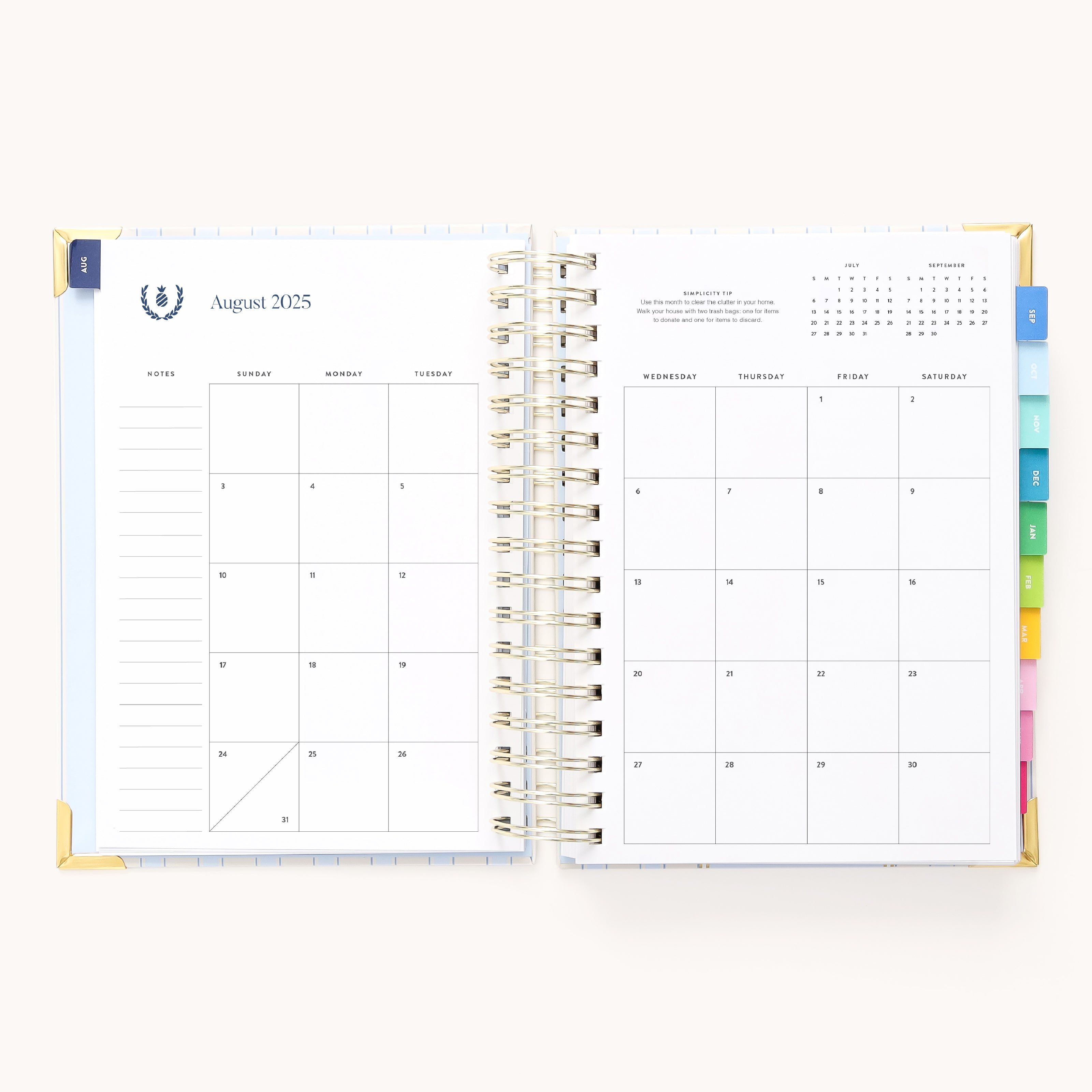 The 2025-2026 Spiral Daily Simplified Planner - Serene Stripe by Simplified features a gold foil detail opening to August 2025 over two pages. The left page has notes sections and a small calendar, while the right offers a large daily grid with dates and a mini next month view at the top.