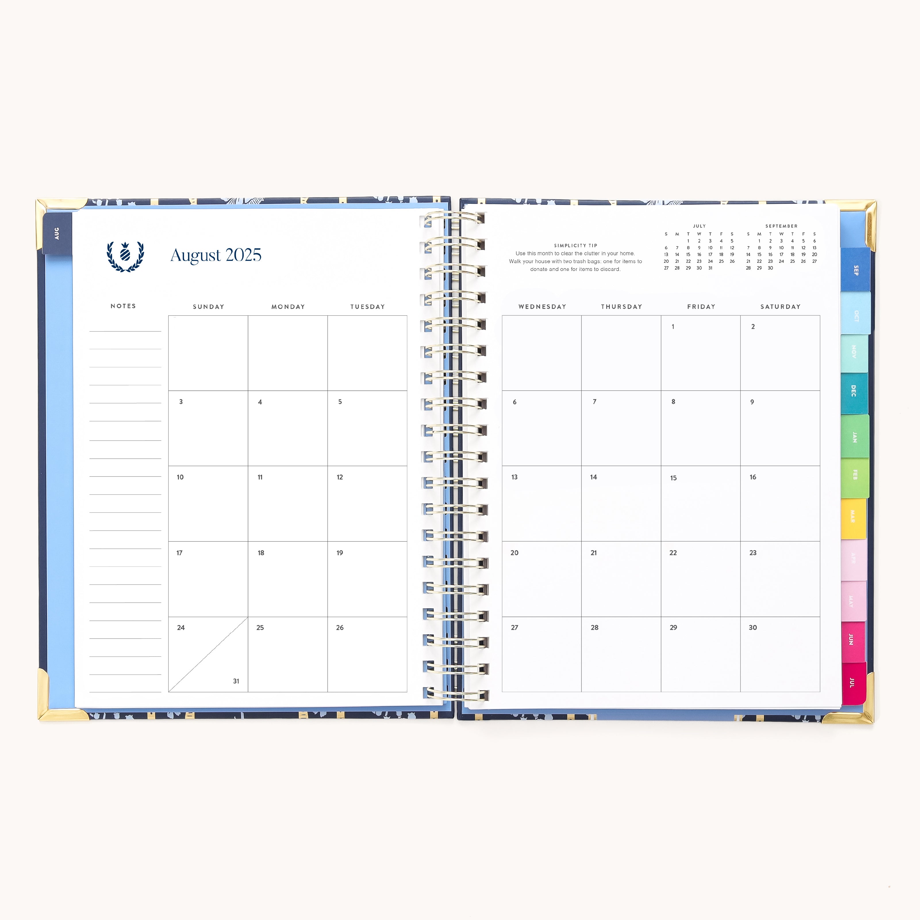 The open 2025-2026 Spiral Weekly Simplified Planner by Simplified features a left-page monthly calendar for August 2025 and right-page organized weekly blank squares, with colorful tabs marking sections, embodying a Simplified approach.