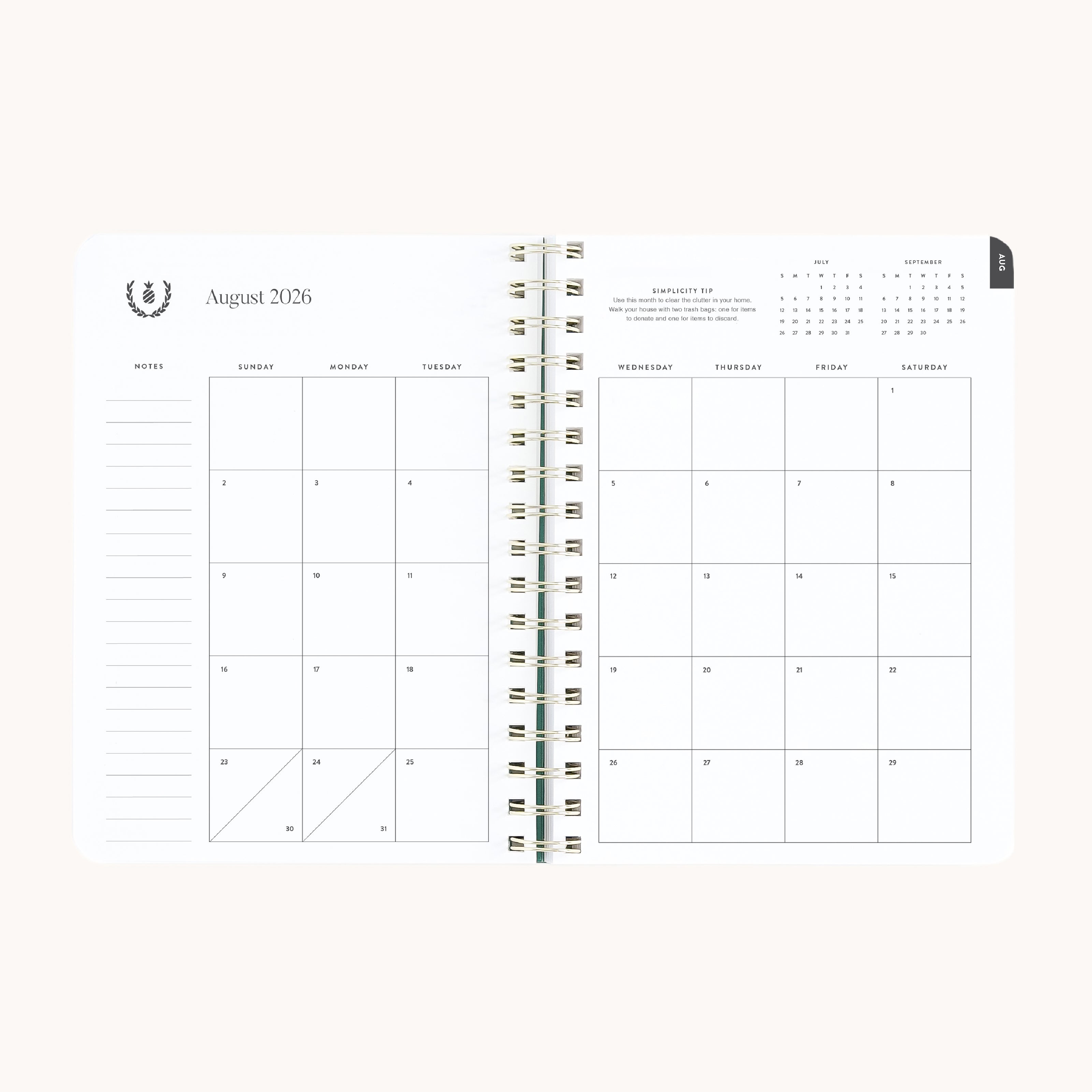 August monthly spread in small softcover weekly planner with clean calendar grid for planning ahead