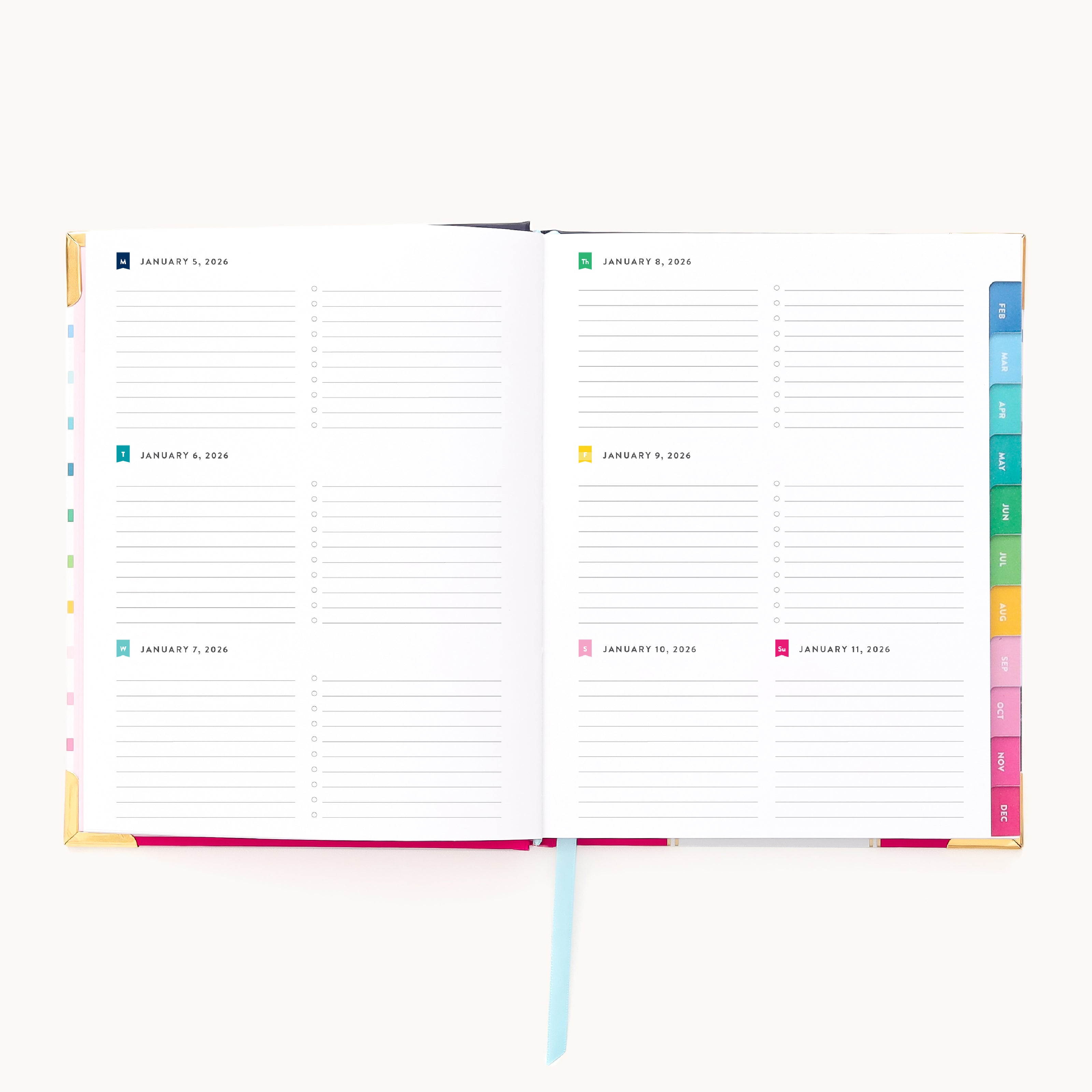 An open 2026 Bookbound Weekly Simplified Planner - Happy Stripe by Simplified, featuring a lay-flat binding, weekly layout with lined daily sections (Jan 7–13, 2026), and colorful index tabs along the right edge.