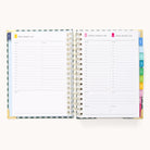The 2026 Spiral Daily Simplified Planner - Camp Gingham by Simplified features daily schedules, colorful tab dividers, and mostly blank pages with lined sections for notes and appointments.
