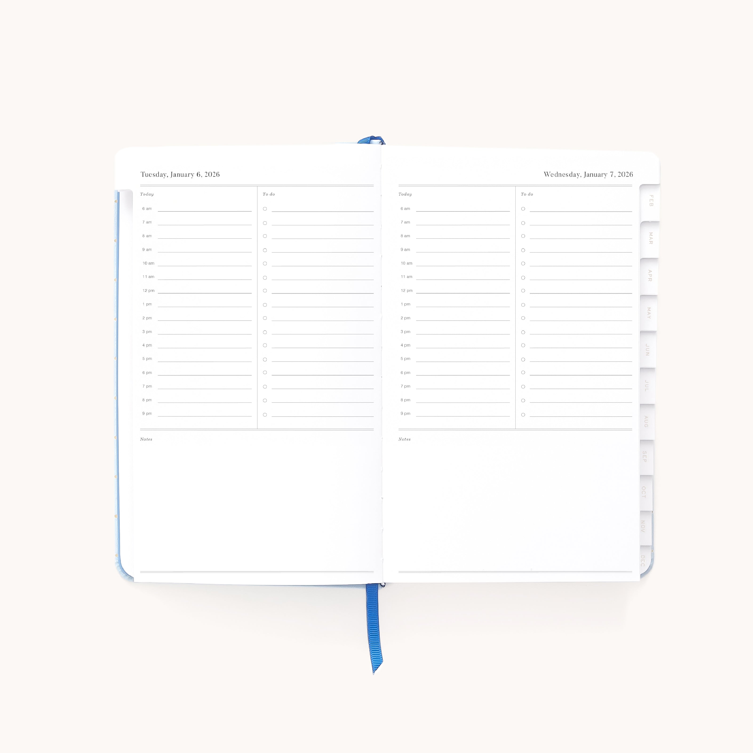 The 2026 Bookbound Daily Dapperdesk Planner - Carolina Dot by Simplified features lined pages for scheduling from 7 a.m. to 8 p.m., note sections, tabbed right pages, a blue ribbon bookmark, and a stylish leatherette cover.
