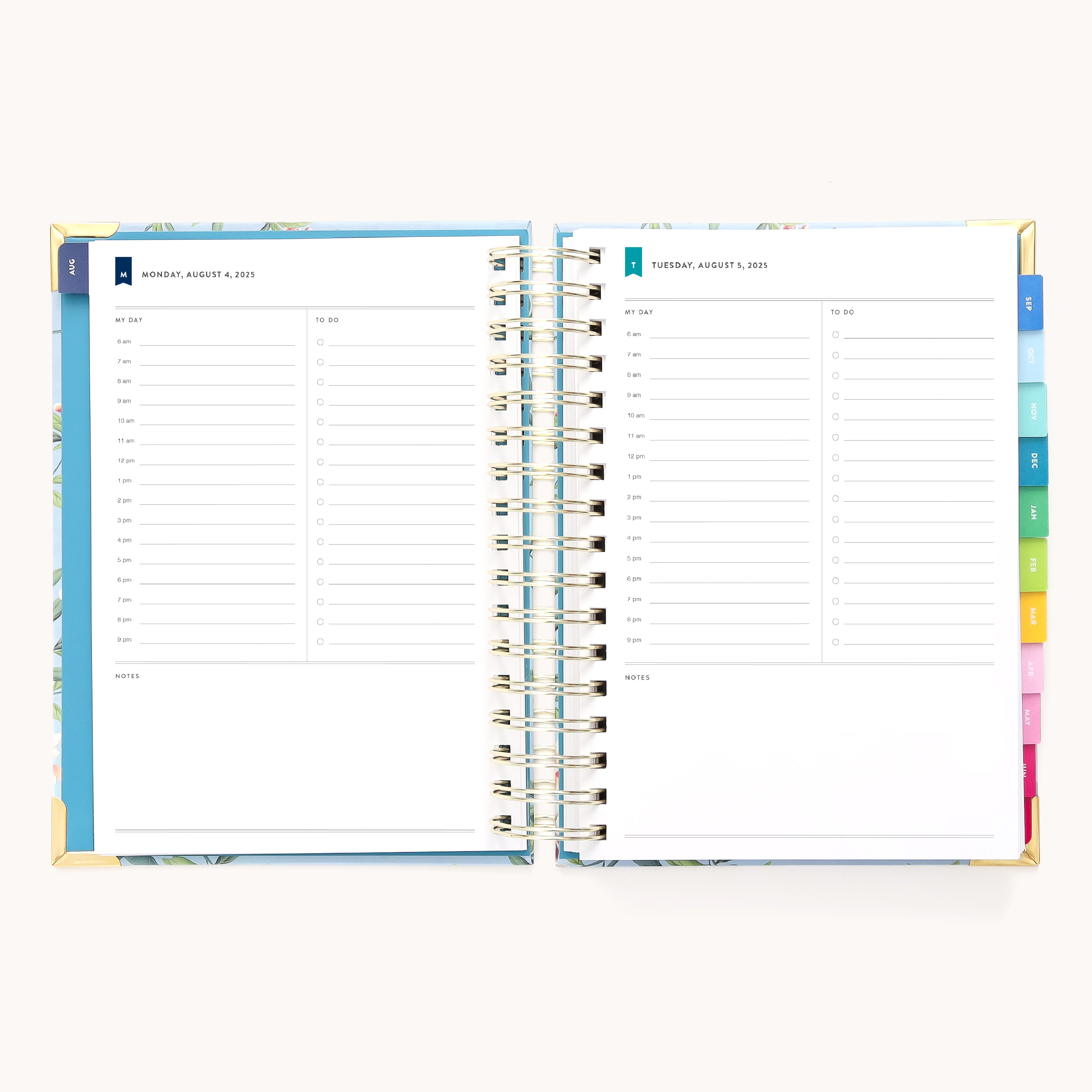 The 2025-2026 Spiral Daily Simplified Planner - Faraway Land by Simplified features an open planner with gold foil, visible spiral binding, and colorful tabs. Pages offer hourly sections from 6 AM to 8 PM and space for notes, encapsulating the charm of a Simplified Planner.