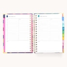 The open 2025-2026 Spiral Daily Simplified Planner - Rainbow Row displays pages for Monday, August 28, and Tuesday, August 29, 2023. Each day runs from 7 AM to 8 PM with lined sections for notes. Colorful tab dividers and gold foil details enhance its elegance.