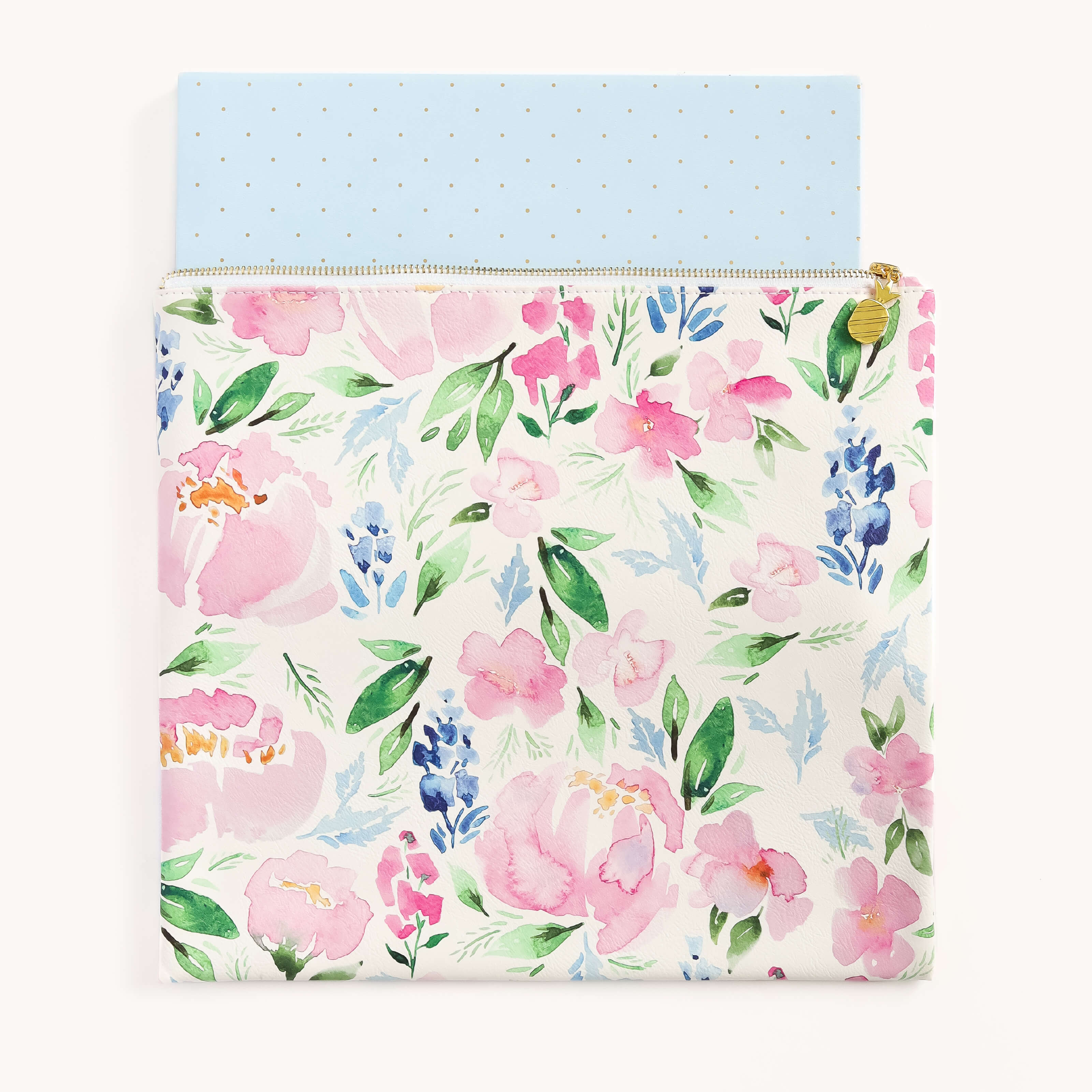 The Simplified Planner Pouch - Cottage Floral features pink, blue, and green watercolor flowers on a creamy background. It partially reveals a light blue interior adorned with small gold polka dots.