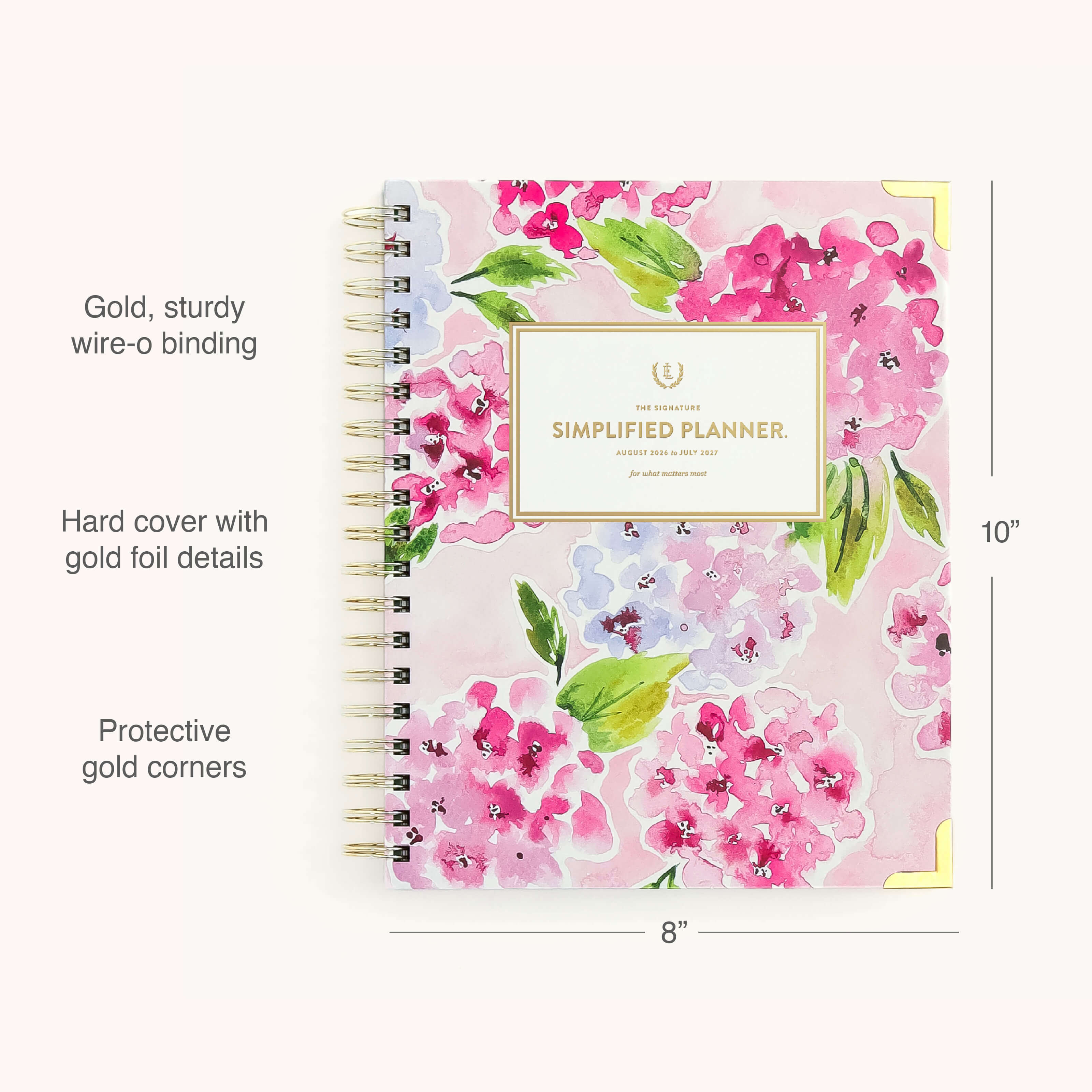 The 2026-2027 Spiral Weekly Simplified Planner - Blush Hydrangea by Simplified features a pink foral design, gold foil accents, sturdy gold wire-o binding, protective gold corners, and measures 10” x 8”.