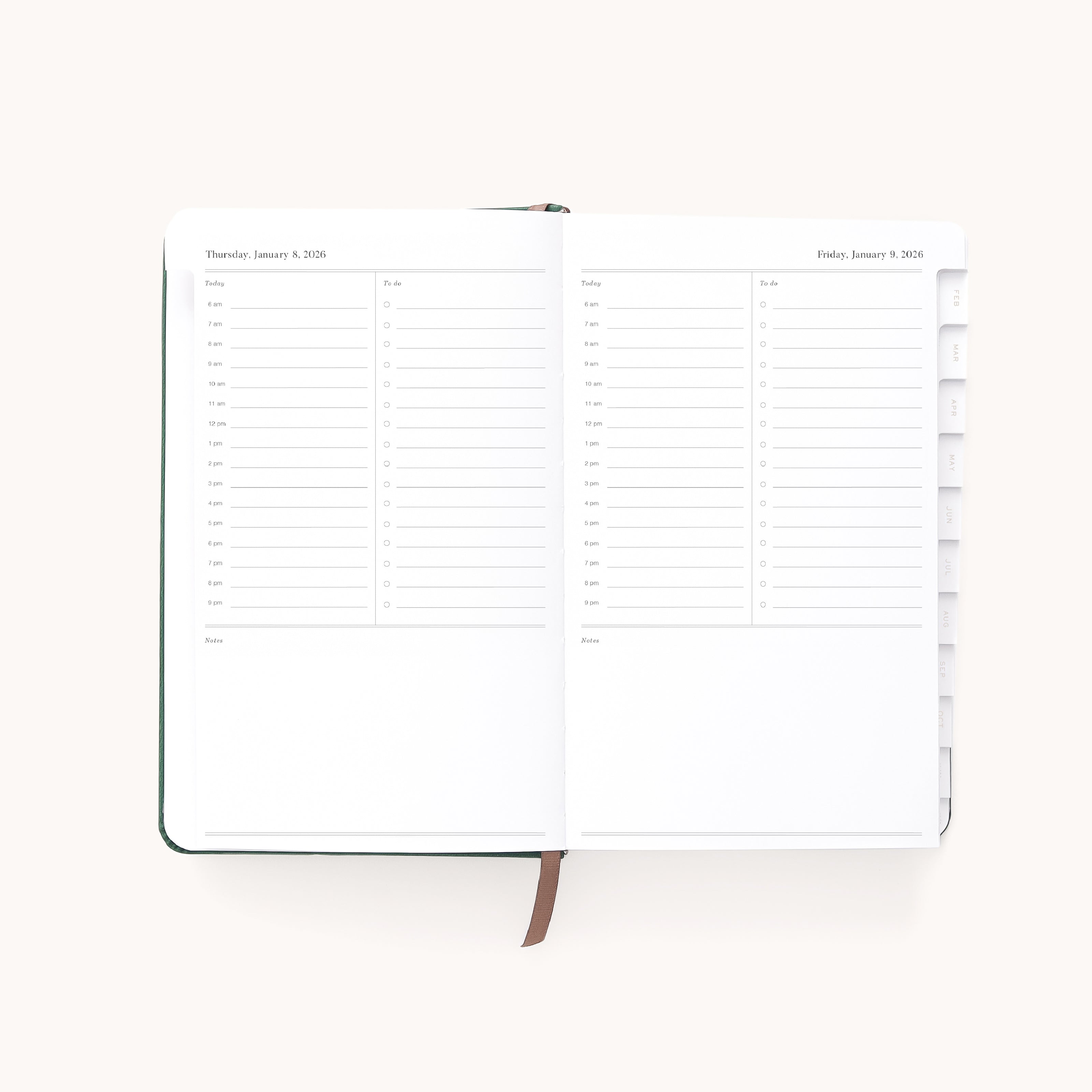 The Simplified 2026 Bookbound Daily Dapperdesk Planner in Evergreen features a leatherette cover, white pages with minimalist black text, daily schedules from 6 a.m. to 8 p.m., note sections, and tabbed monthly dividers for easy organization.