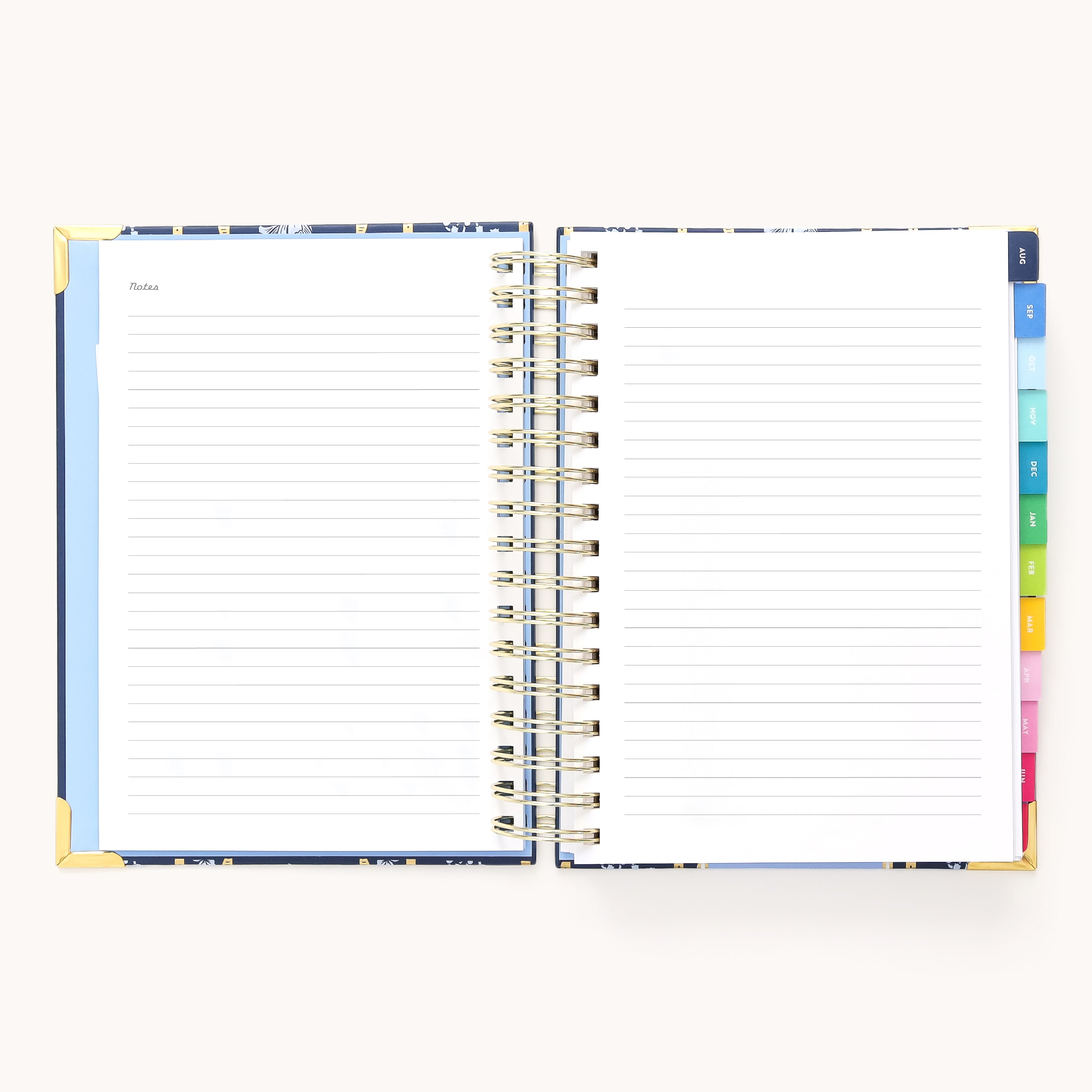 The 2025-2026 Spiral Daily Simplified Planner - Poppy Posies by Simplified features lined pages with colorful tab dividers. The left page, adorned with gold foil details titled Notes, provides blank space for writing and pairs perfectly with Simplified Planner layouts for organized planning.
