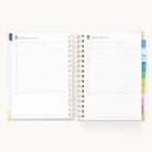 The 2025-2026 Spiral Daily Simplified Planner - Serene Stripe by Simplified has a spiral-bound design with gold foil, showcasing a weekly layout for August 2-3, 2023. Each page includes sections for schedules, to-do lists, and notes. Colorful tabs on the right edge ensure easy navigation.