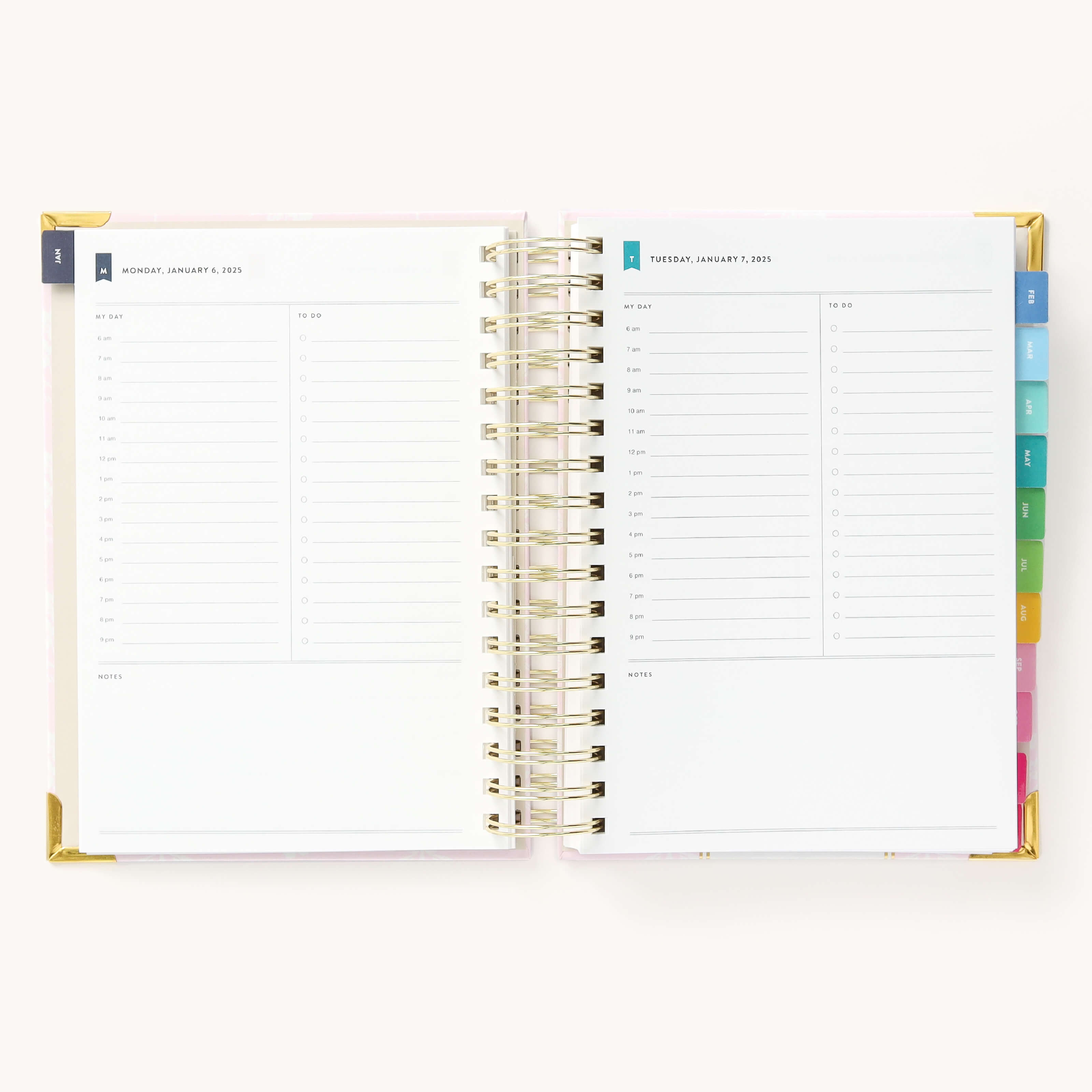 2025 Daily Simplified Planner by Emily Ley in the Blush Block cover design open to a two-page daily spread featuring Monday and Tuesday. Features a clean, minimalistic design with lined sections for daily tasks, to-do lists, and notes. Includes color-coded weekday labels, durable spiral binding, and gold corner protectors.