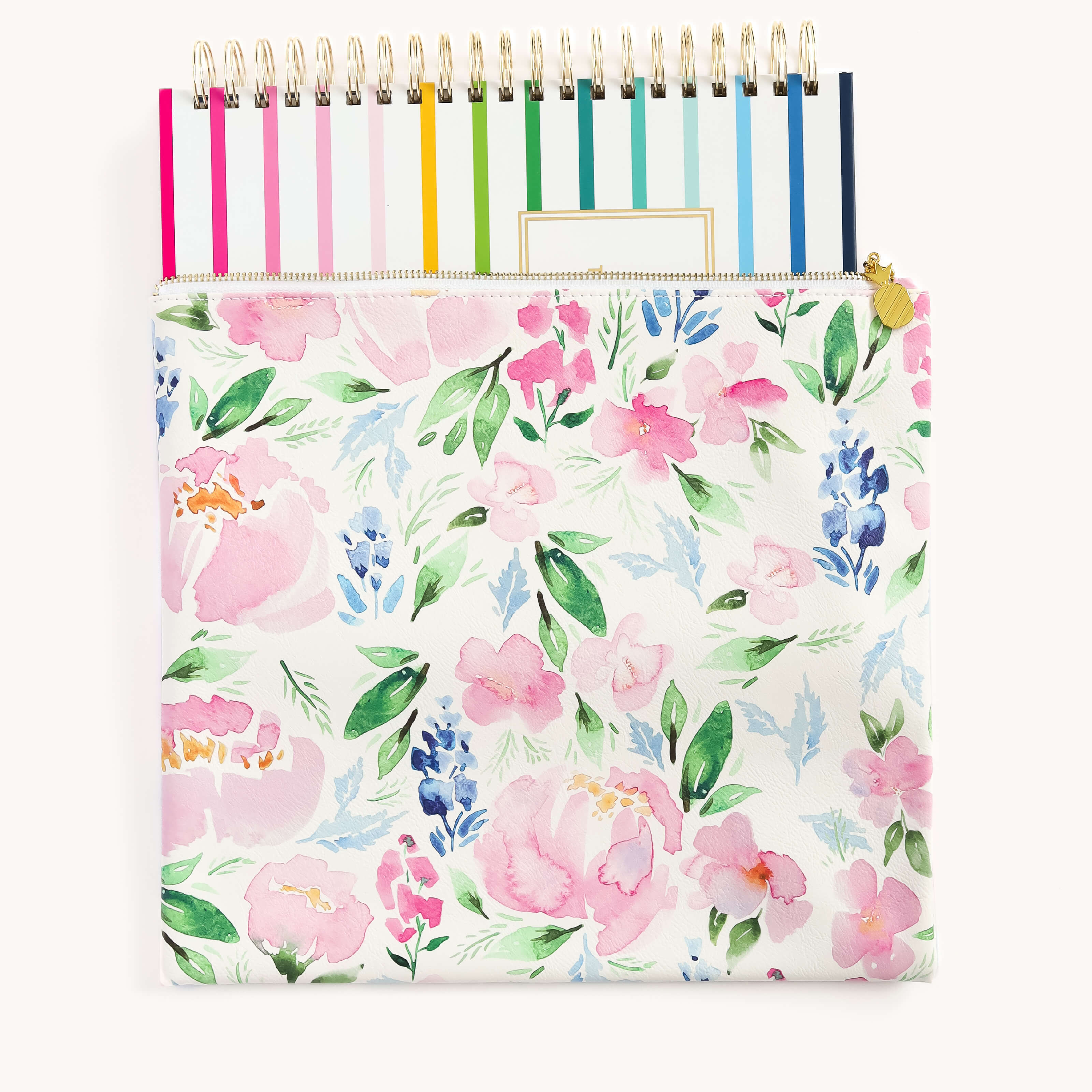 The Simplified Planner Pouch - Cottage Floral is a stylish storage solution with pink and blue flowers on white, partially covering colorful spiral-bound notebooks with gold wire. Made from durable leatherette, its perfect for your everyday essentials.