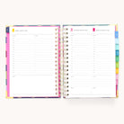 The 2025-2026 Spiral Daily Simplified Planner - Rainbow Row by Simplified showcases daily pages each with time slots from 7 AM to 7 PM and a notes section. Colorful tabs with gold foil accents denote sections, all neatly spiral-bound.