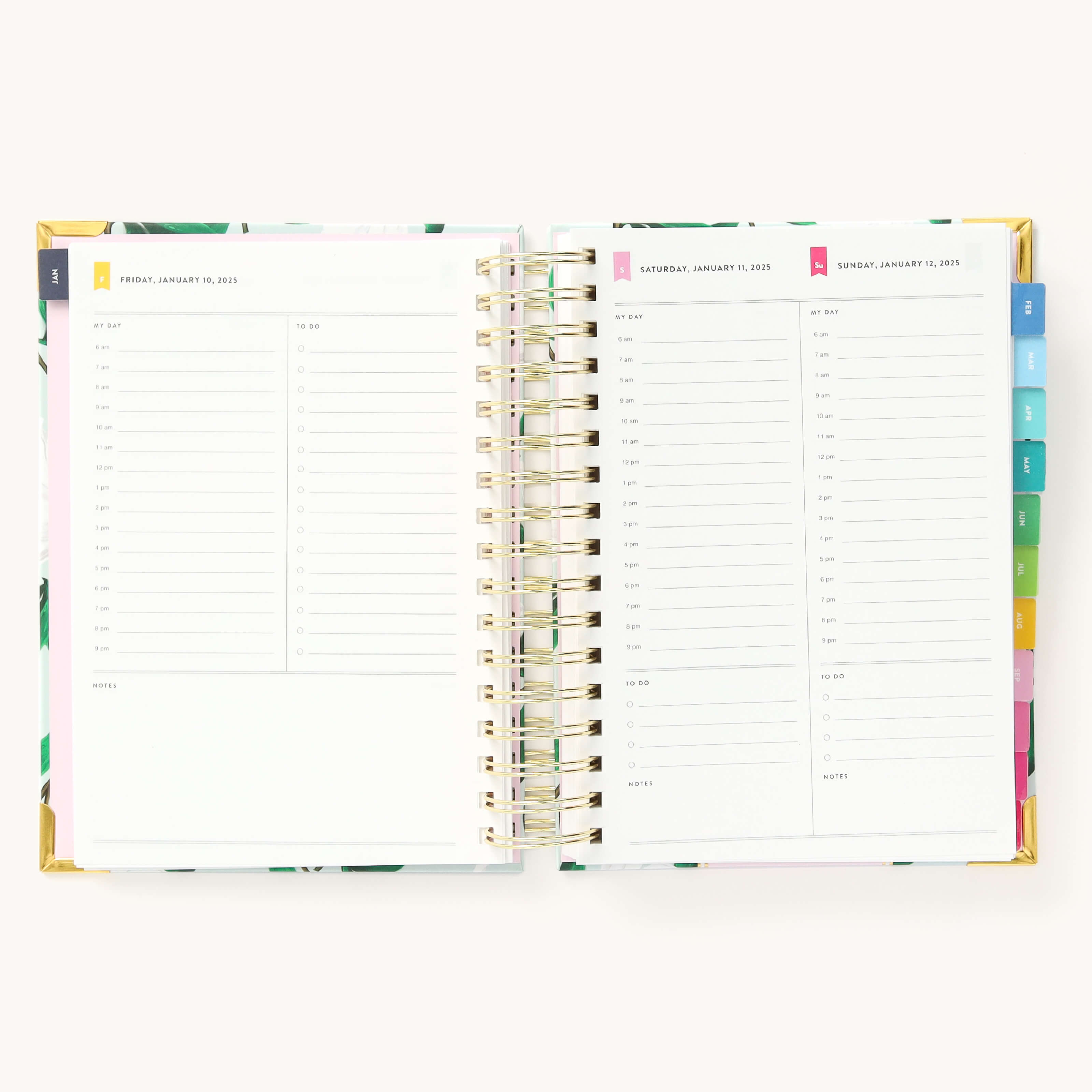 2025 Daily Simplified Planner by Emily Ley in the Savannah Blooms cover design open to a two-page weekend spread. Features a clean, minimalistic design with lined sections for daily tasks, to-do lists, and notes. Includes color-coded weekday labels, durable spiral binding, and gold corner protectors.
