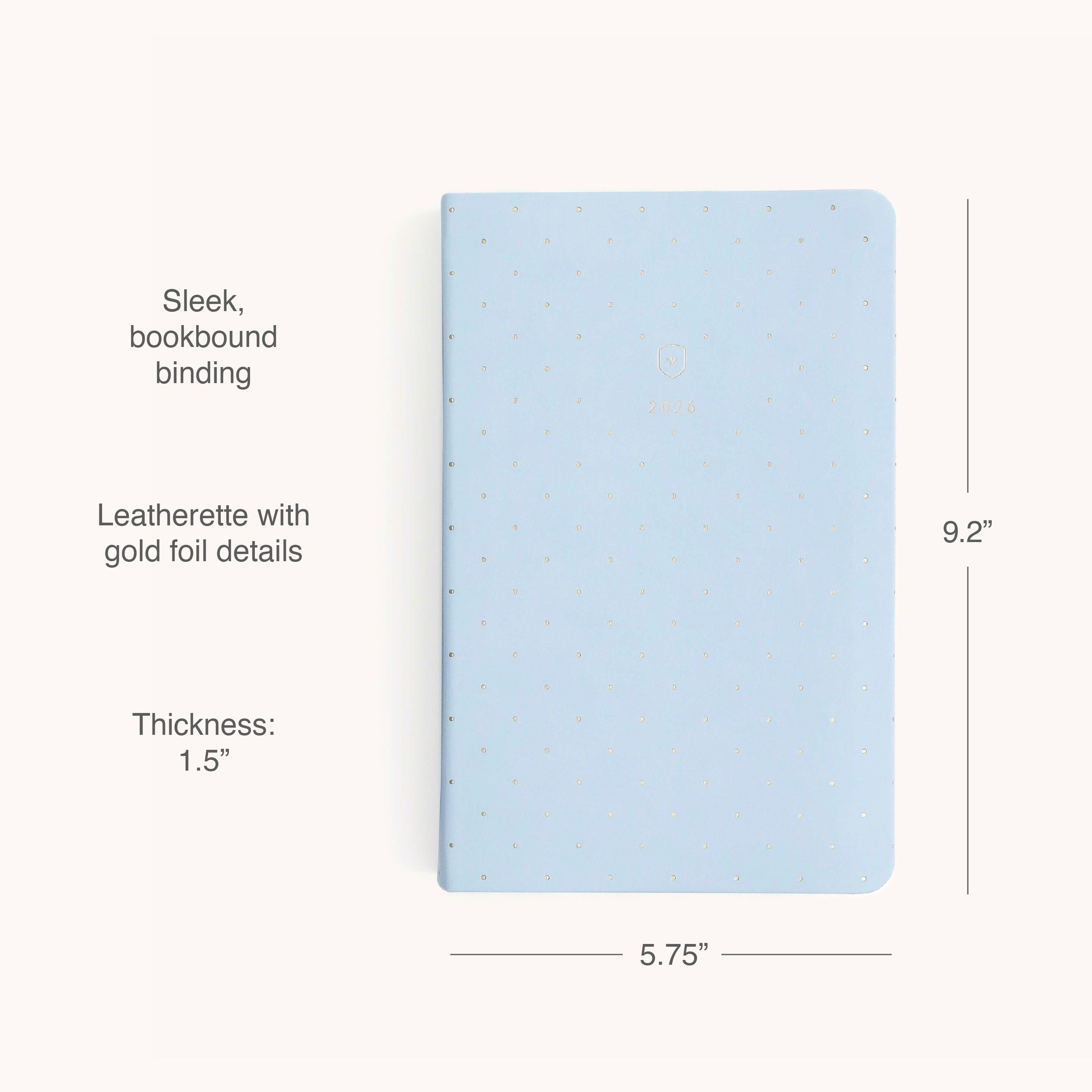 The Simplified 2026 Bookbound Daily Dapperdesk Planner - Carolina Dot features light blue leatherette with gold foil dots, rounded corners, and measures 9.2 x 5.75, combining style, durability, and a sleek daily layout for 12 months.