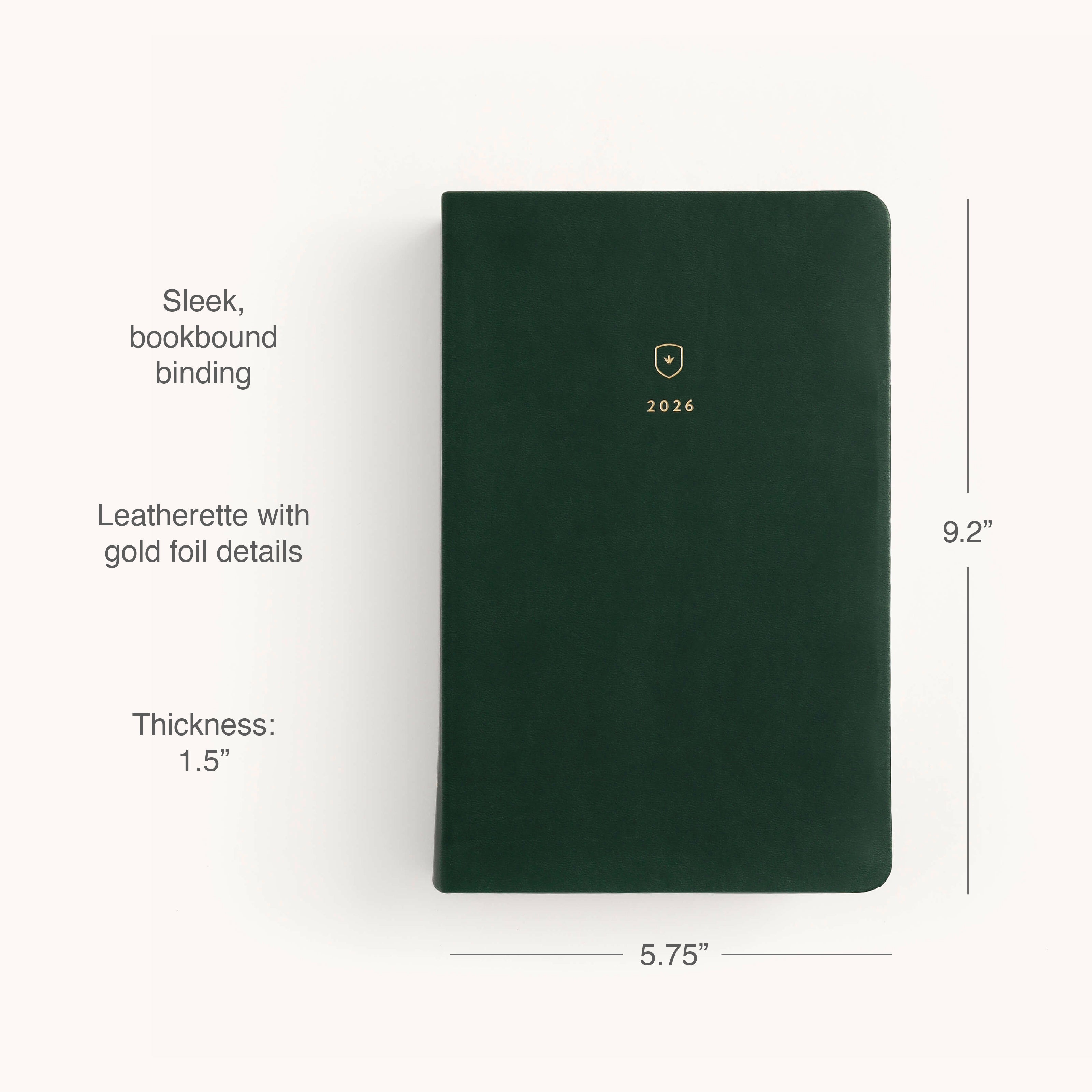 The Simplified 2026 Bookbound Daily Dapperdesk Planner in Evergreen features a dark green leatherette cover with gold foil crest, durable bookbound binding, and measures 9.2” x 5.75” x 1.5” for organized planning all year.