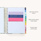 The 2025-2026 Spiral Daily Simplified Planner - Camp Gingham by Simplified features blank white pages with gold foil accents on the corners, colorful tab dividers on the right, and colored stencils with letters and numbers on the left, making it perfect for your prep work.