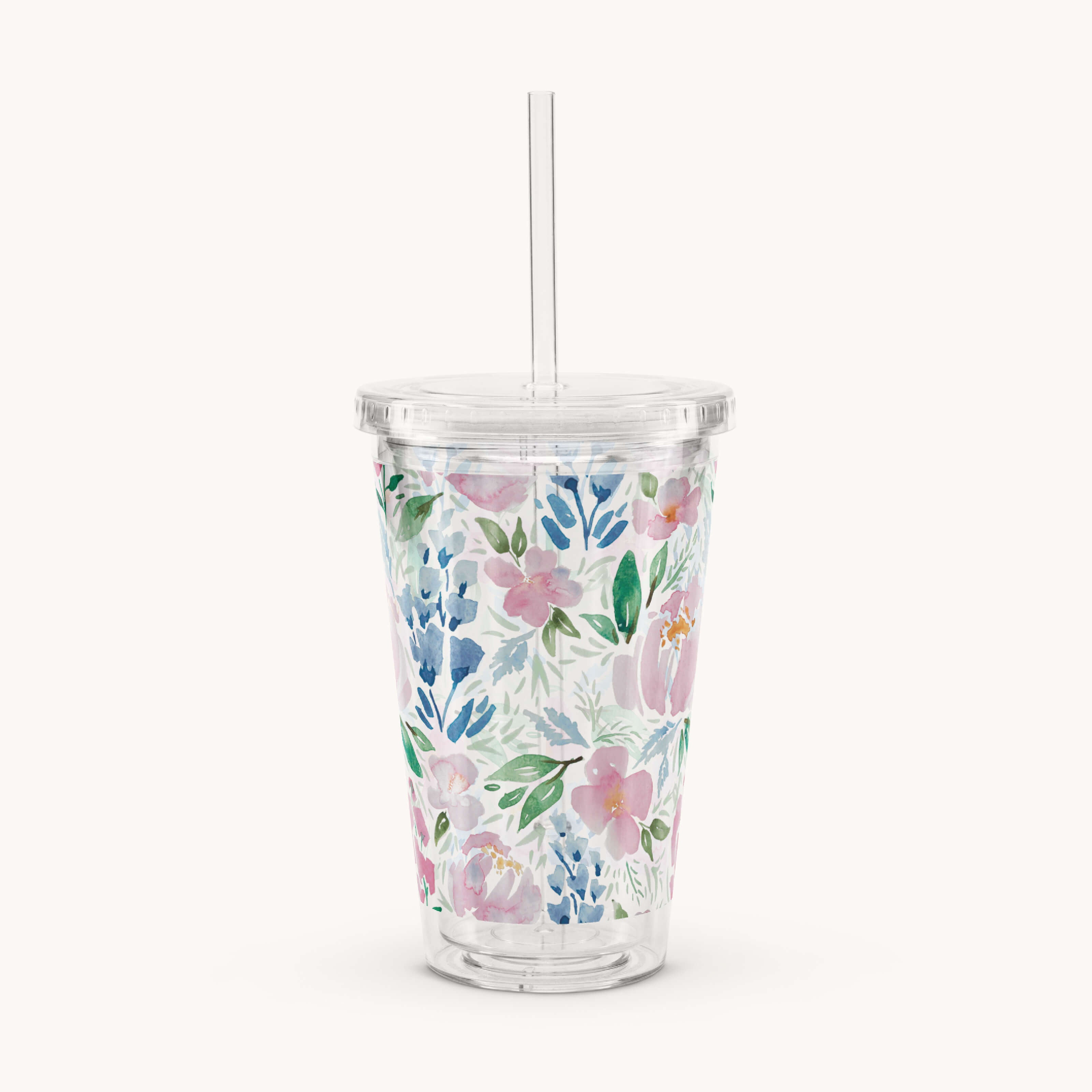 The Simplified Clear Tumbler - Cottage Floral is a reusable 16oz cup with a lid and straw, decorated with pink, blue, and green watercolor-style flowers and leaves on clear plastic.