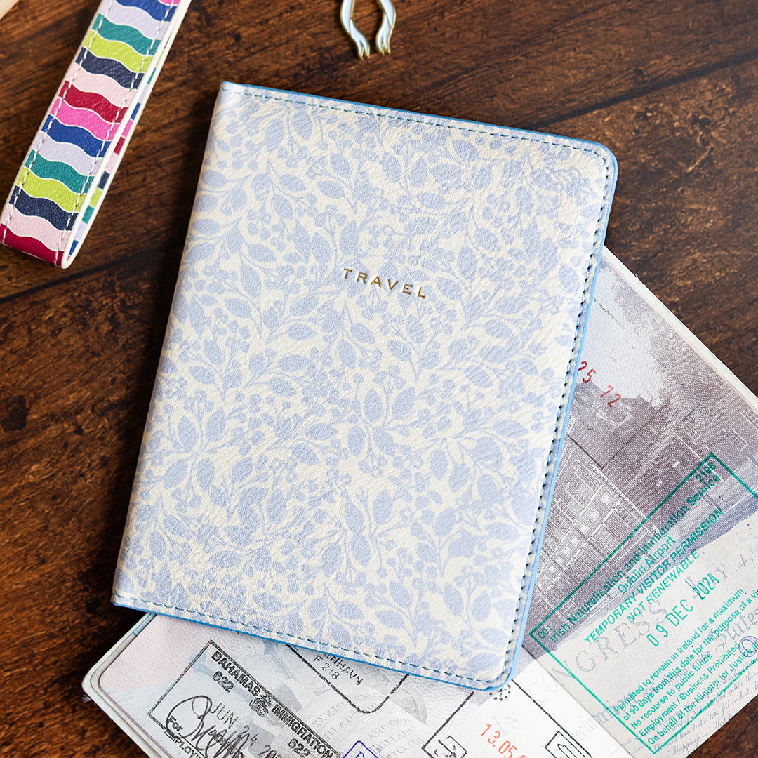 Misty Meadow floral passport holder with travel documents by Simplified by Emily Ley
