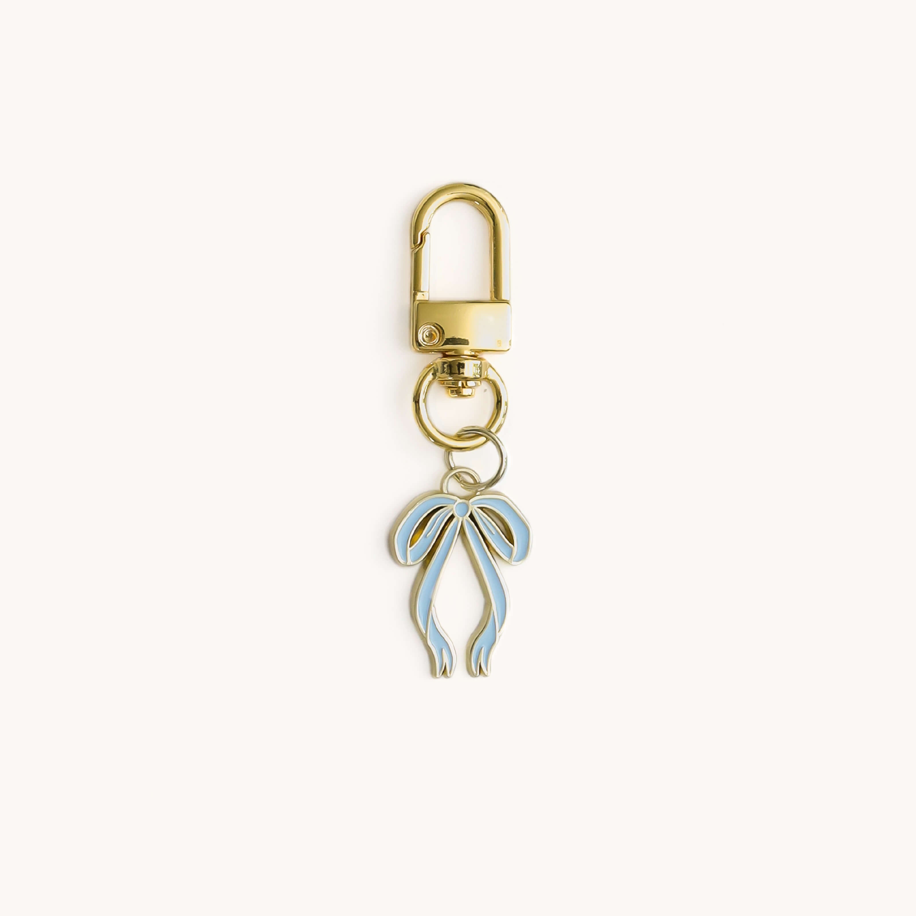 Bow enamel charm with gold clasp key ring by Simplified by Emily Ley