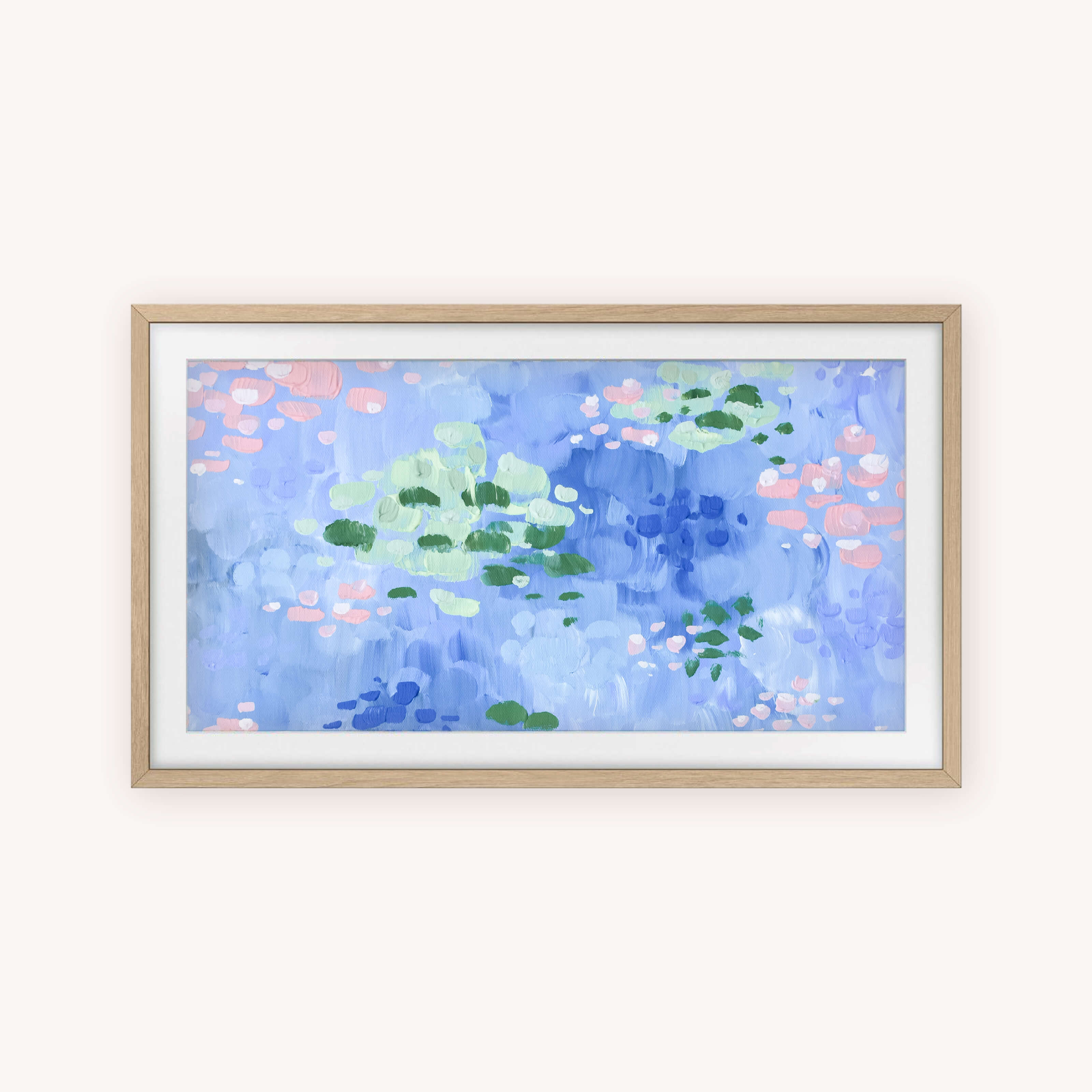 Simplified’s Frame TV Art - Lilypad showcases abstract green, pink, and white water lilies on blue, inspired by Monet. This instant digital download is perfect for your Frame TV. Display includes a light wood frame with white mat.