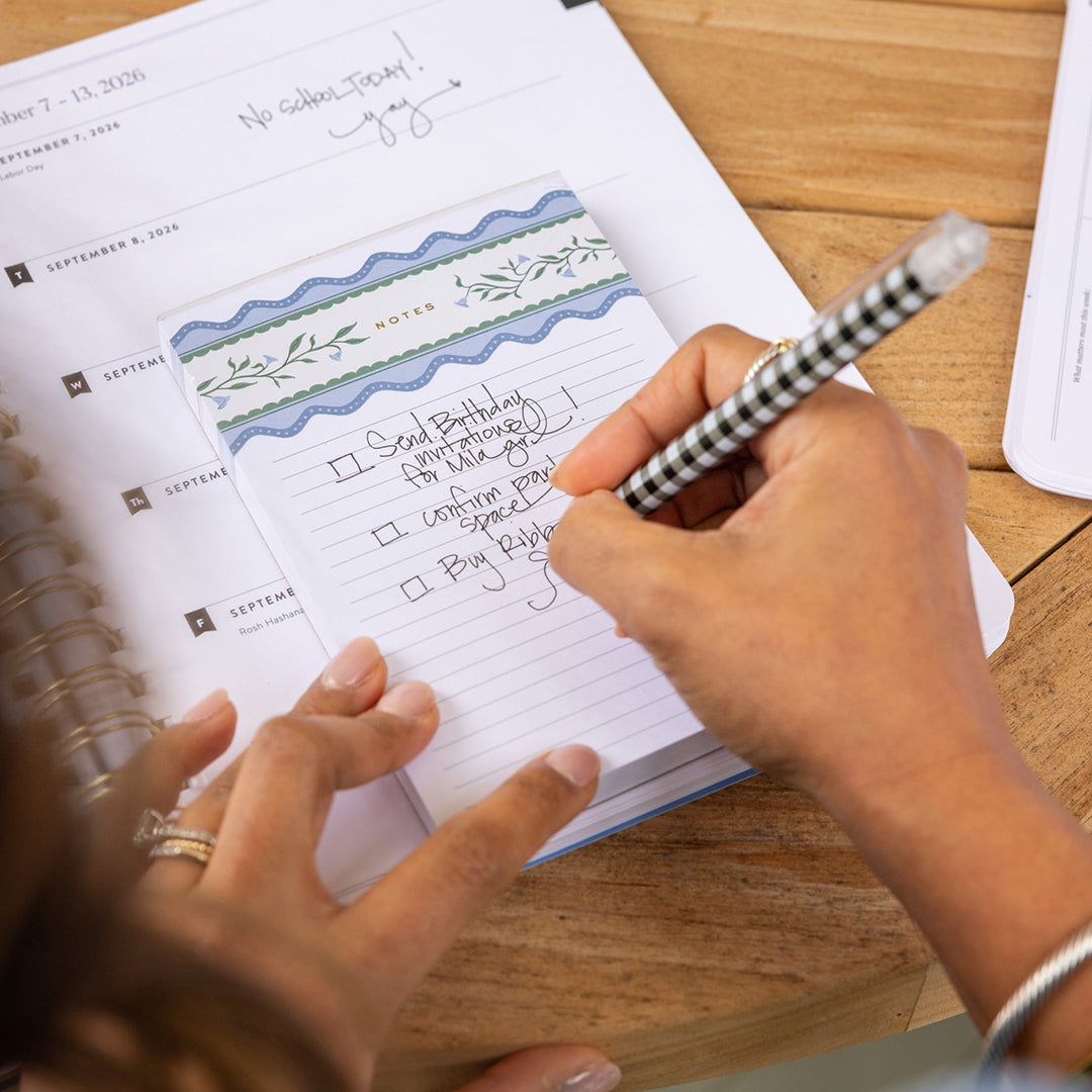 Hand writing on Floral Stripe Notepad