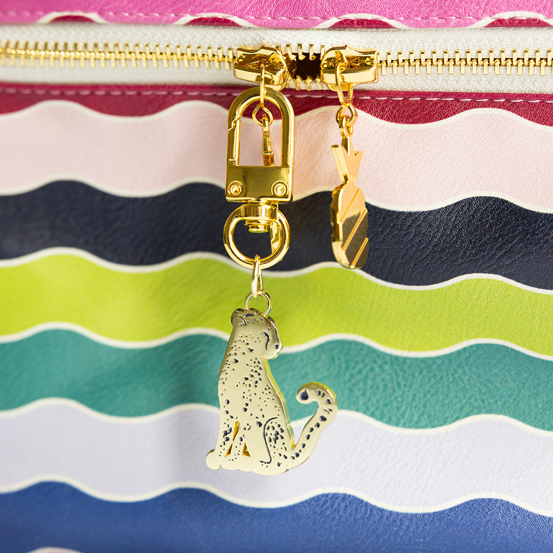 Cheetah enamel charm clipped to Rainbow Row Train Case Set zipper by Simplified by Emily Ley