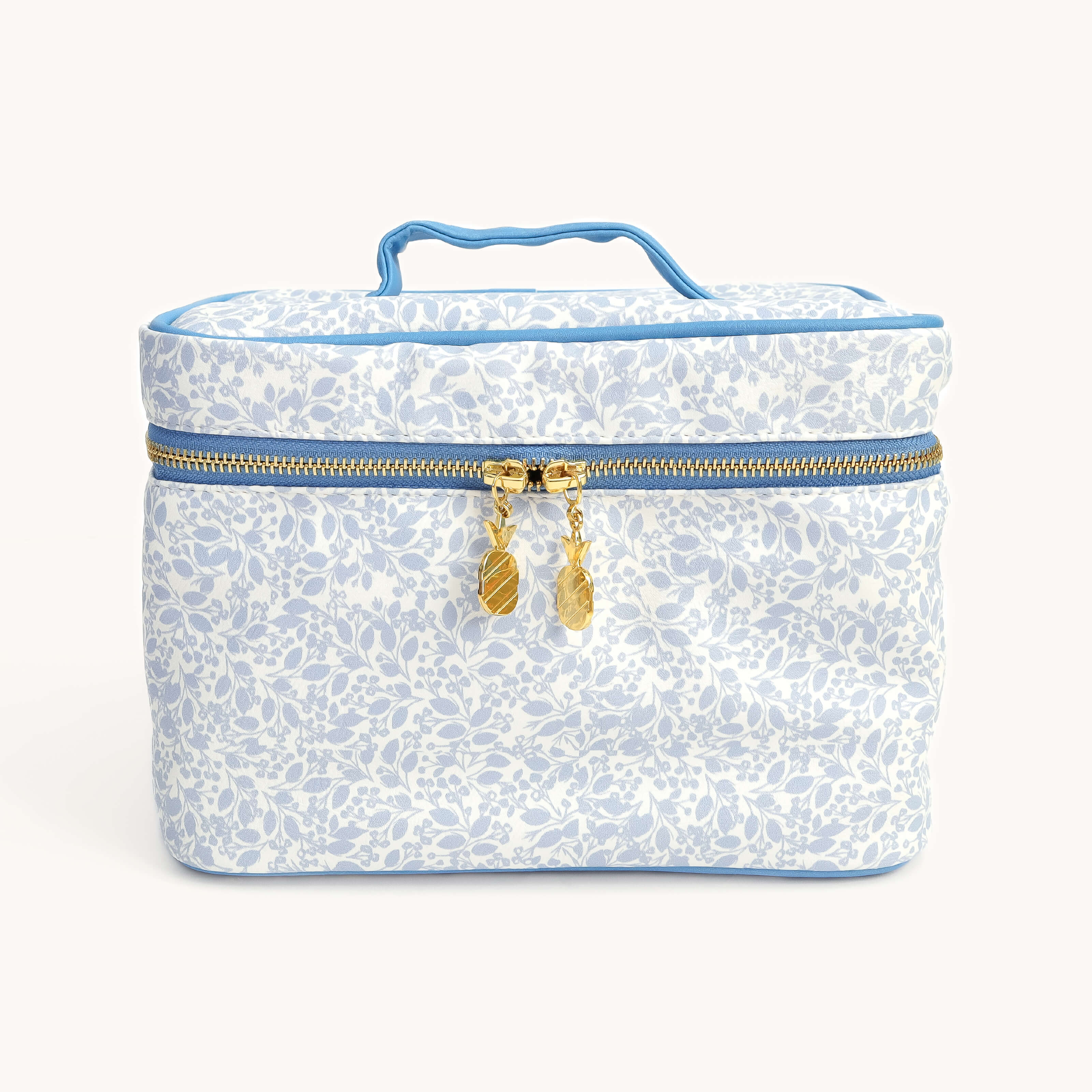 Blue floral travel cosmetic bag with top handle and gold zipper by Simplified by Emily Ley