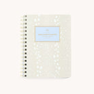 The 2026 Softcover Weekly Simplified Planner - Ivory Antelope by Simplified features a cream and white speckled cover with Simplified Planner in gold and blue on the front, ideal for streamlined planning and simplified prep work.