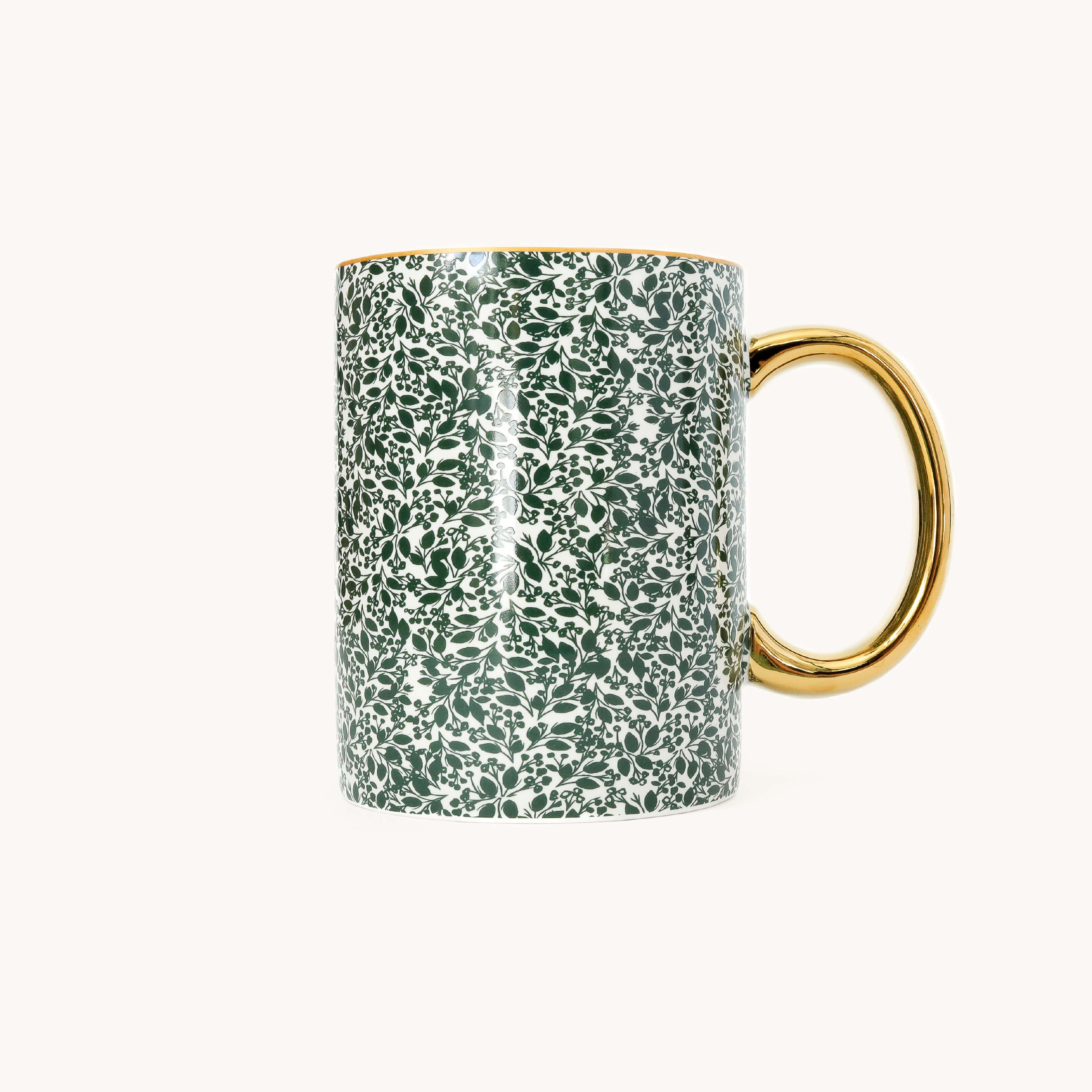 Emerald Floral Ceramic Mug in a dark green leaf and berry print on white with a glossy gold handle and gold rim