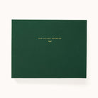 Evergreen Holiday Memories Book, a green linen Christmas card album with gold foil Our Holiday Memories title on the cover