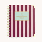Berry Stripe spiral weekly planner with bold striped cover, gold corners, and wire binding for easy weekly planning