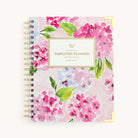 Blush Hydrangea spiral weekly planner with floral cover, gold corners, and wire binding for easy weekly planning
