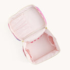 Open pastel pink lined cosmetic bag with structured interior – roomy travel toiletry organizer with top handle