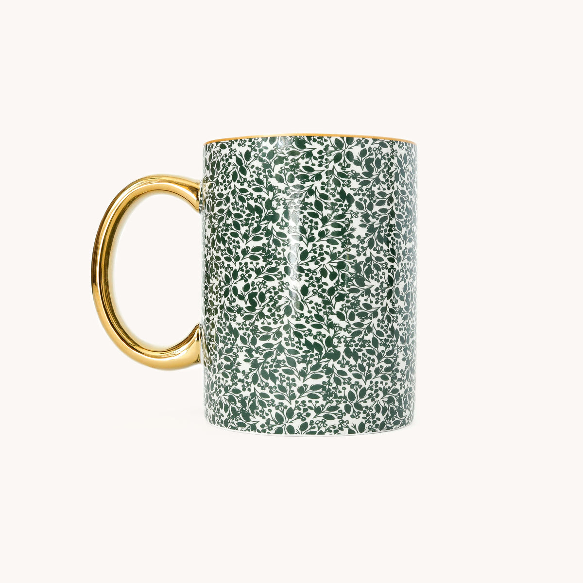 Emerald Floral Ceramic Mug, reverse side, with the gold handle on the left and an all-over green leaf and berry print