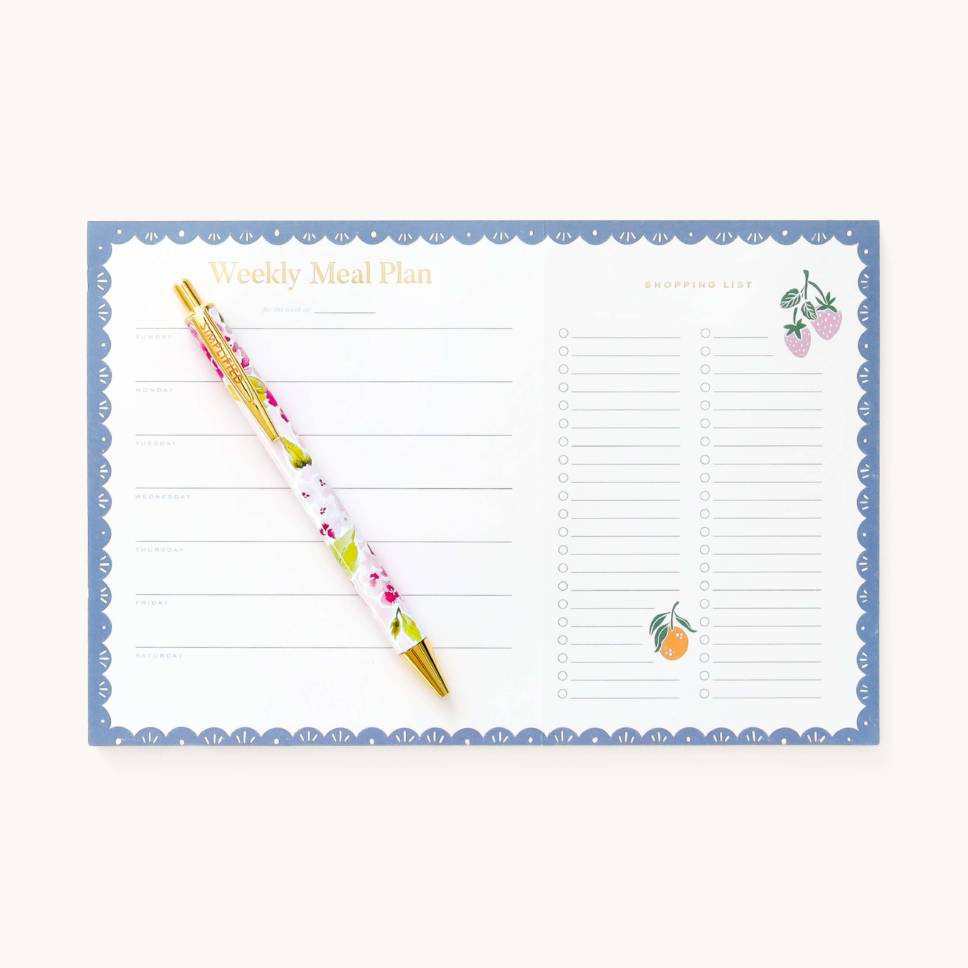 Blush Hydrangea click pen resting on weekly meal planner 