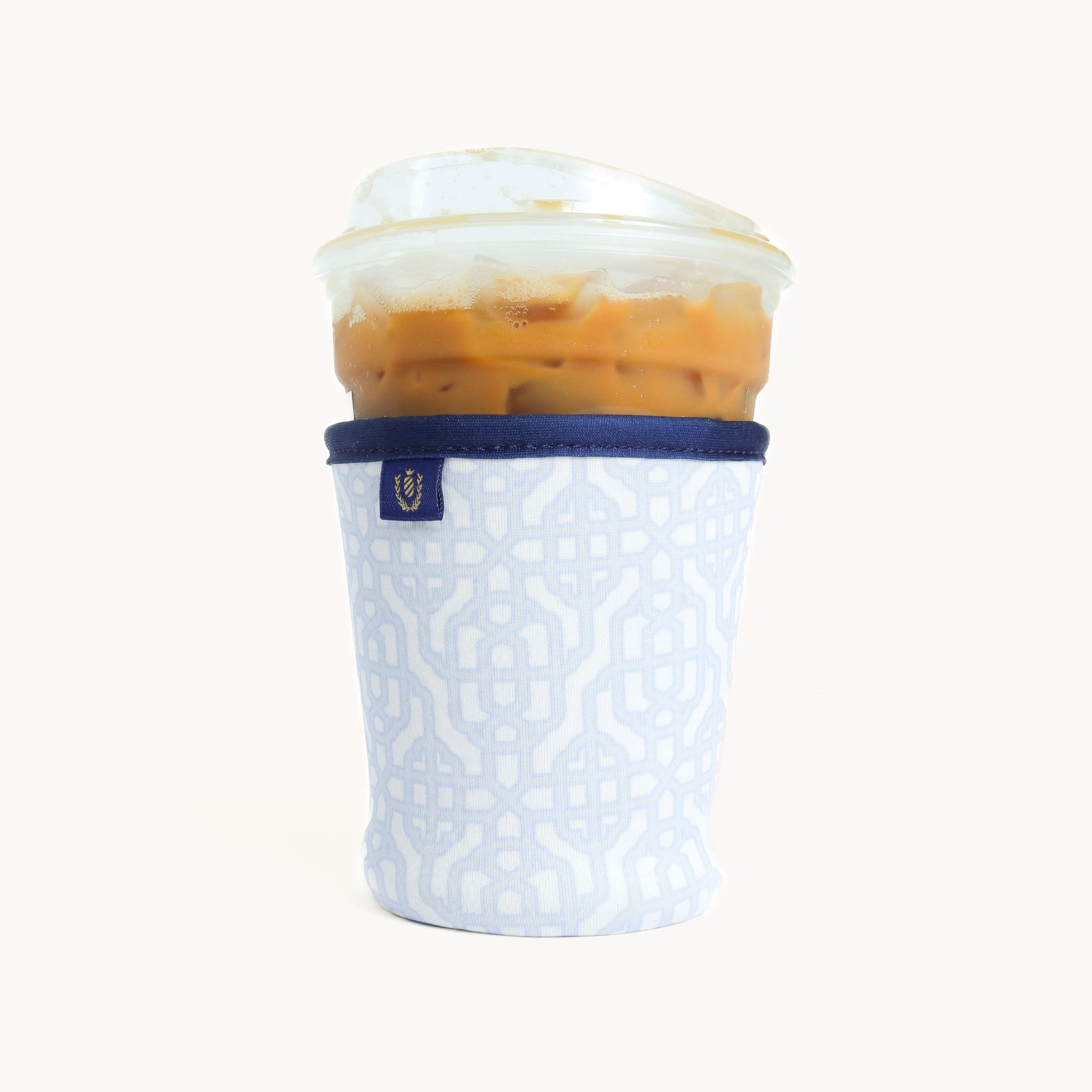 Carolina Trellis Coffee Cooler with an iced coffee inside on white background. 