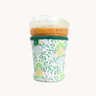 Pineapple Charm Coffee Cooler with an iced coffee inside on white background. 