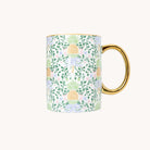 Other side of Pineapple Charm mug with pineapple and floral pattern on a white background