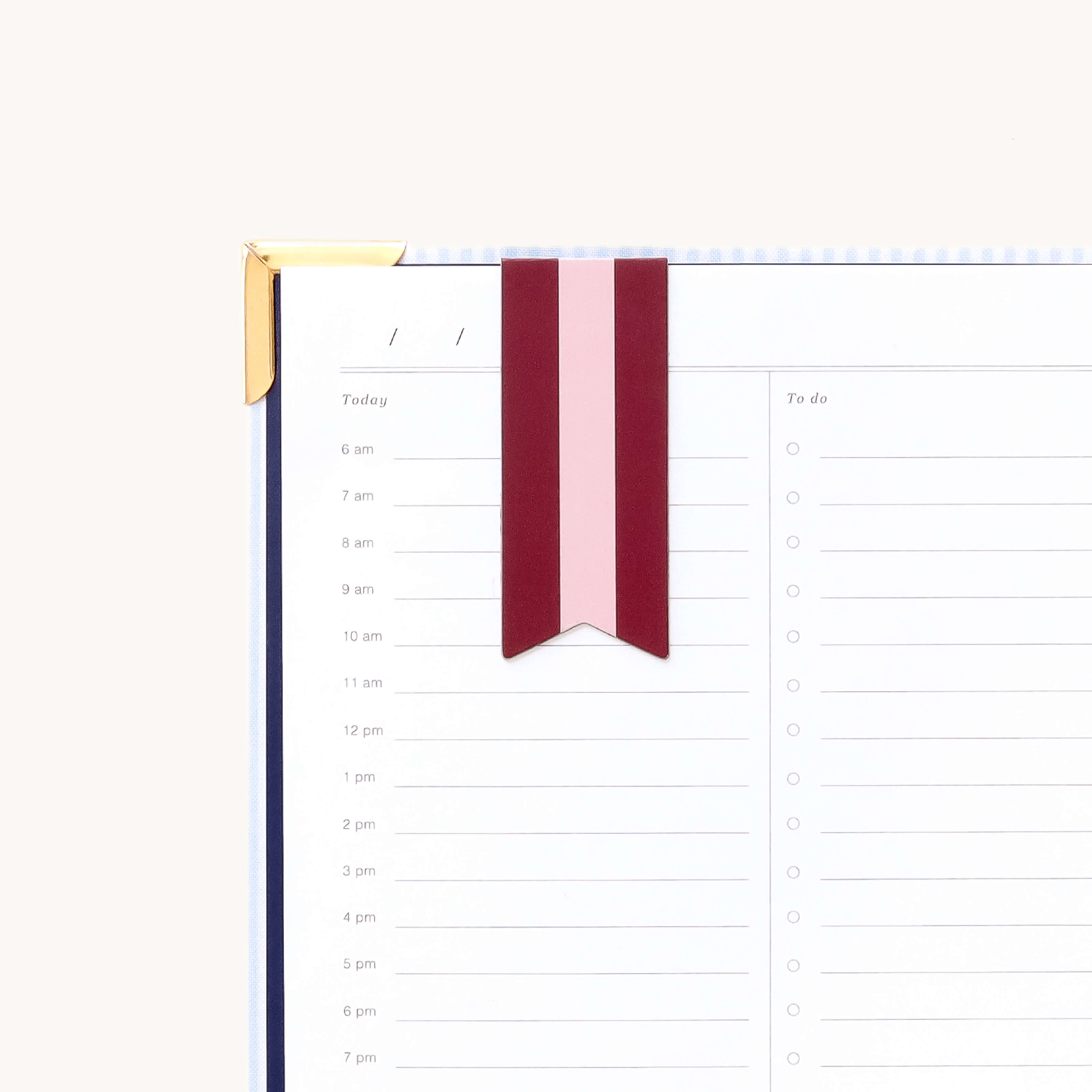 Magnetic page marker clipped onto planner page with Berry Stripe design for easily marking your place and organizing daily plans