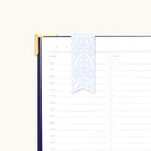 Magnetic page marker clipped onto planner page with Carolina Trellis design for easily marking your place and organizing daily plans
