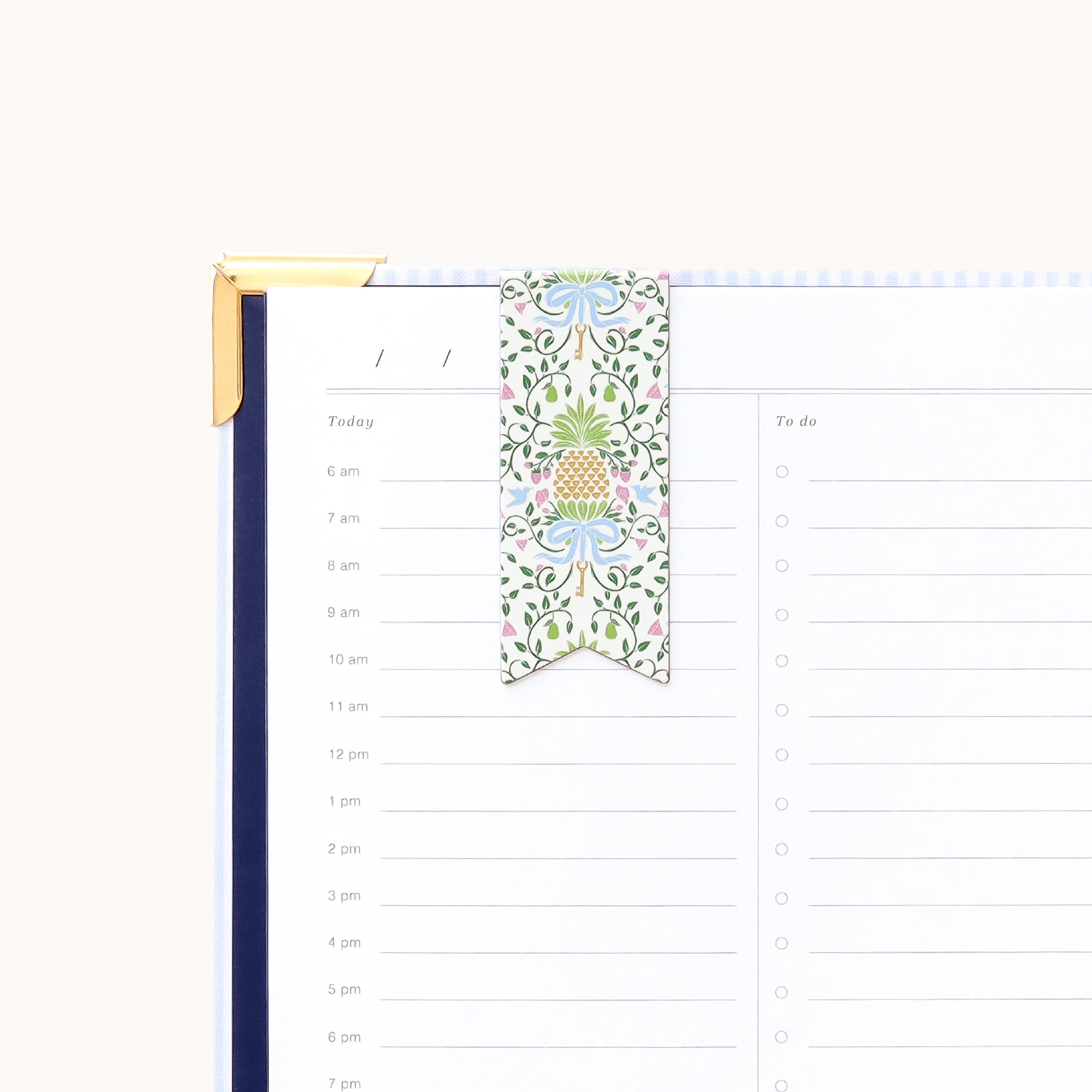 Magnetic page marker clipped onto planner page with Pineapple Charm design for easily marking your place and organizing daily plans