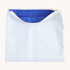 Carolina Trellis pouch unzipped to reveal spacious interior with blue lining for storing planners, pens, and accessories